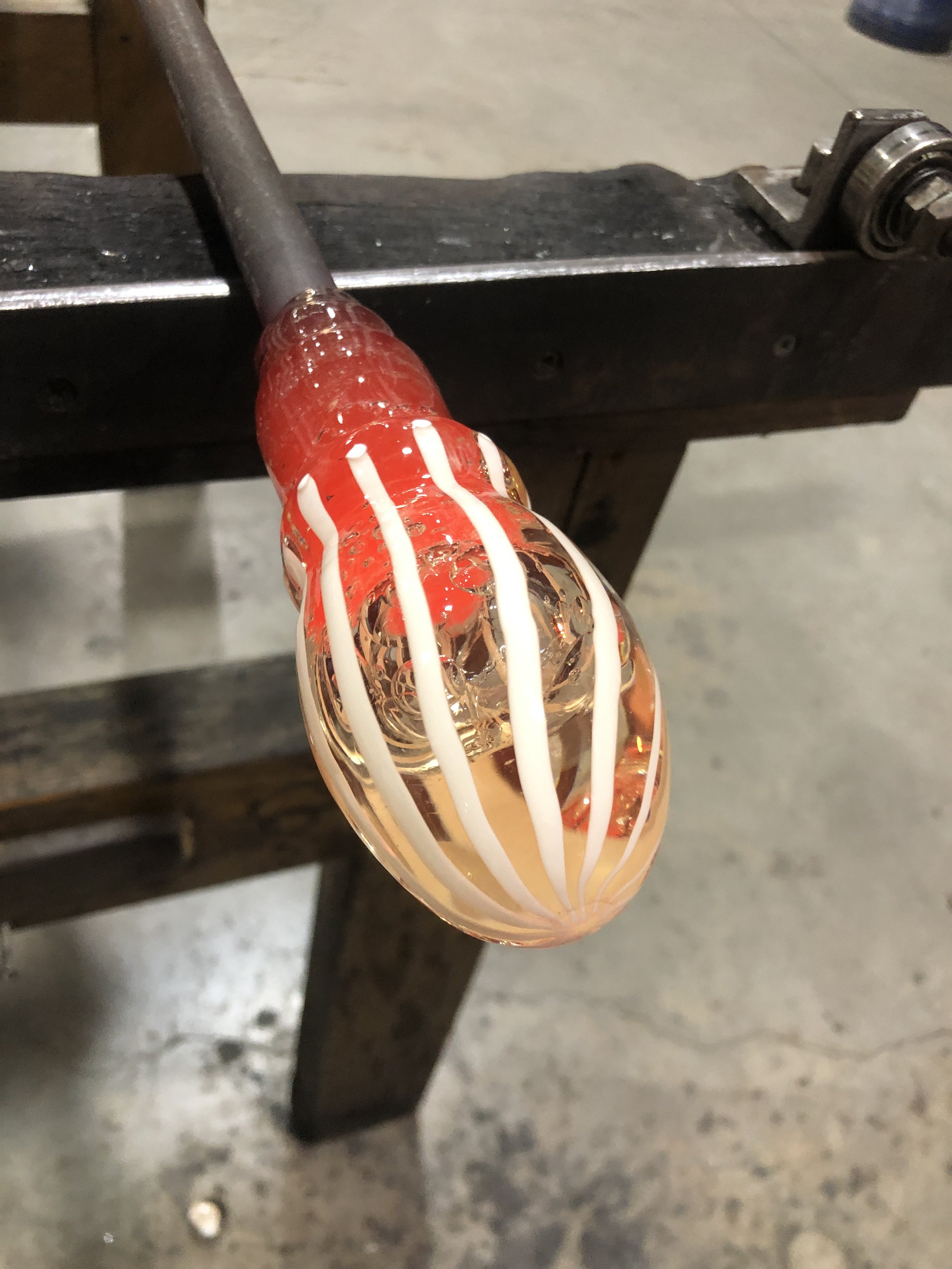 Forming the molten glass with added opaque white cane