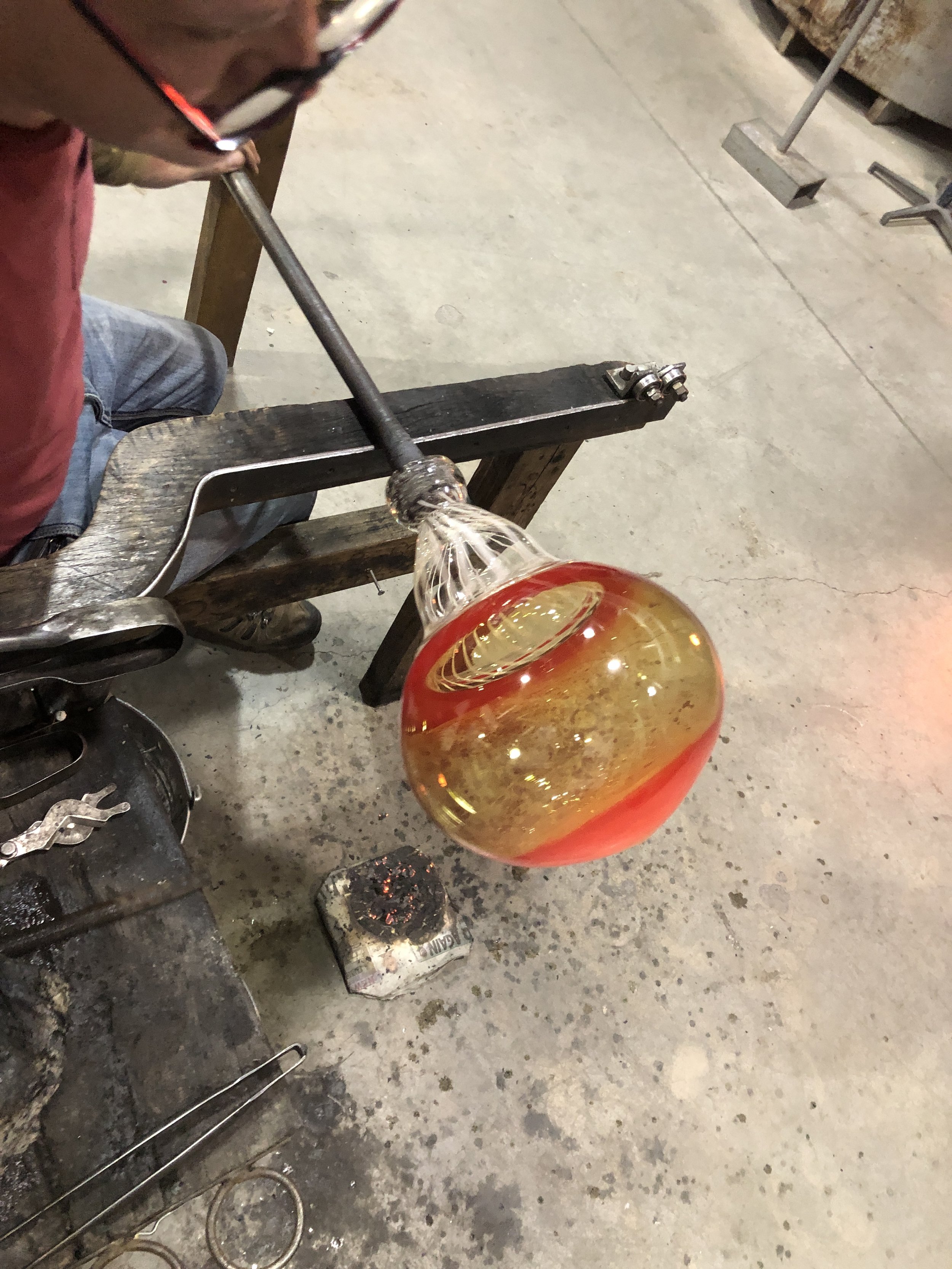 Further shaping of the hot glass