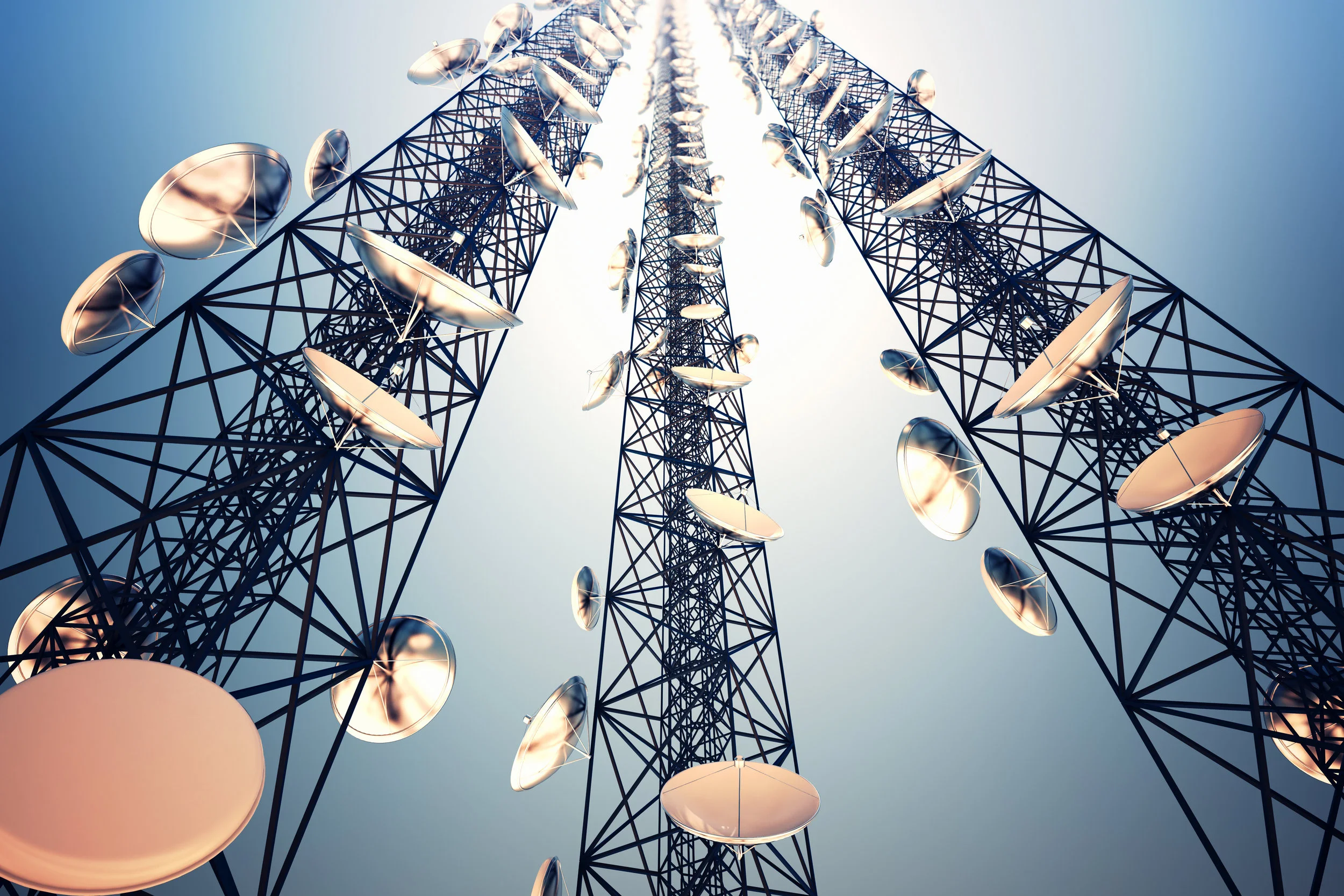 Telecoms tower with dishes above telco cooling by EcoCooling