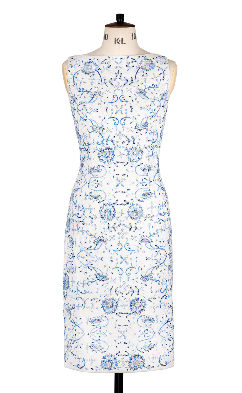 White dress with porcelain and rune design embroidery