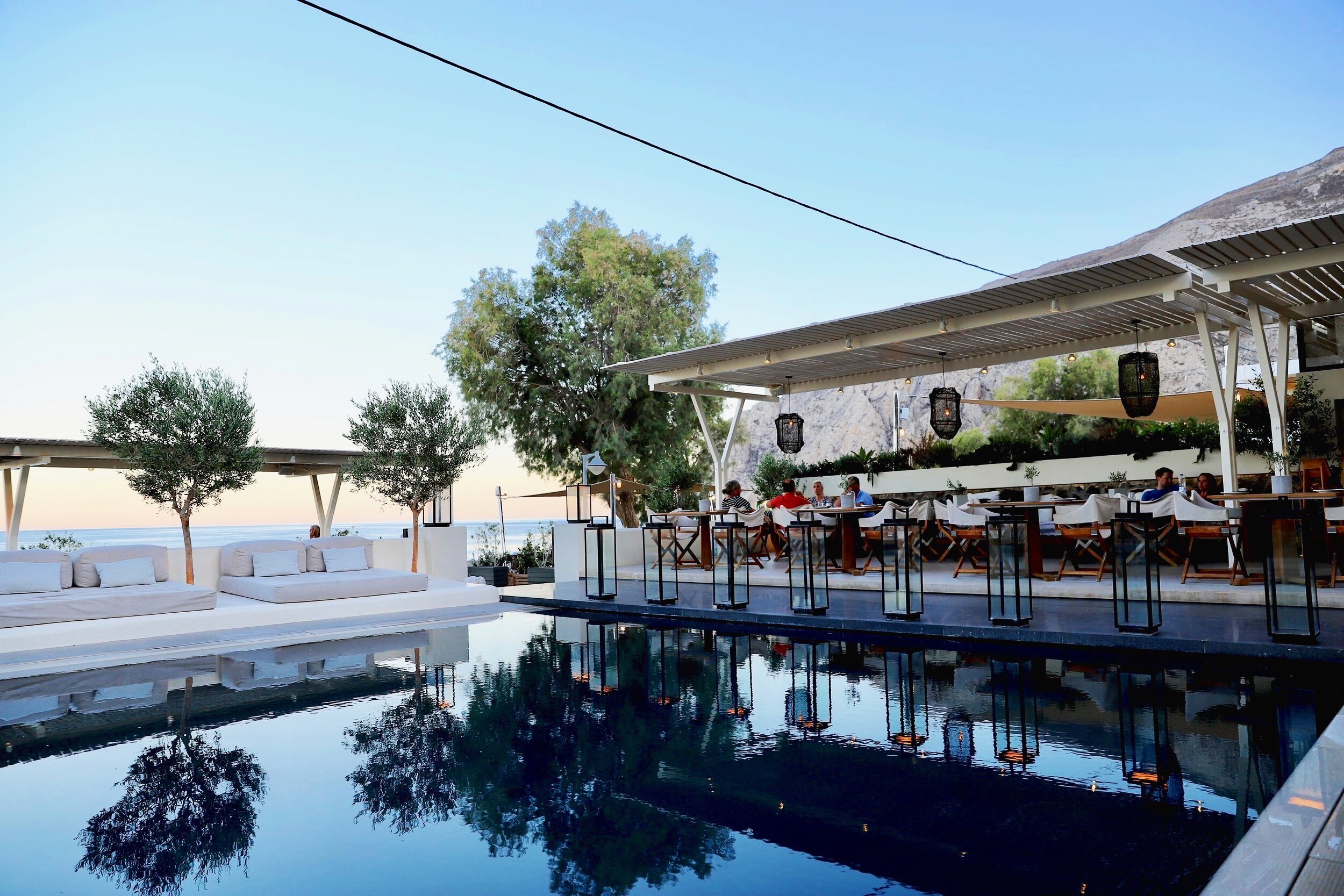 Pool and restaurant at the Bellonias Villas hotel Santorini.