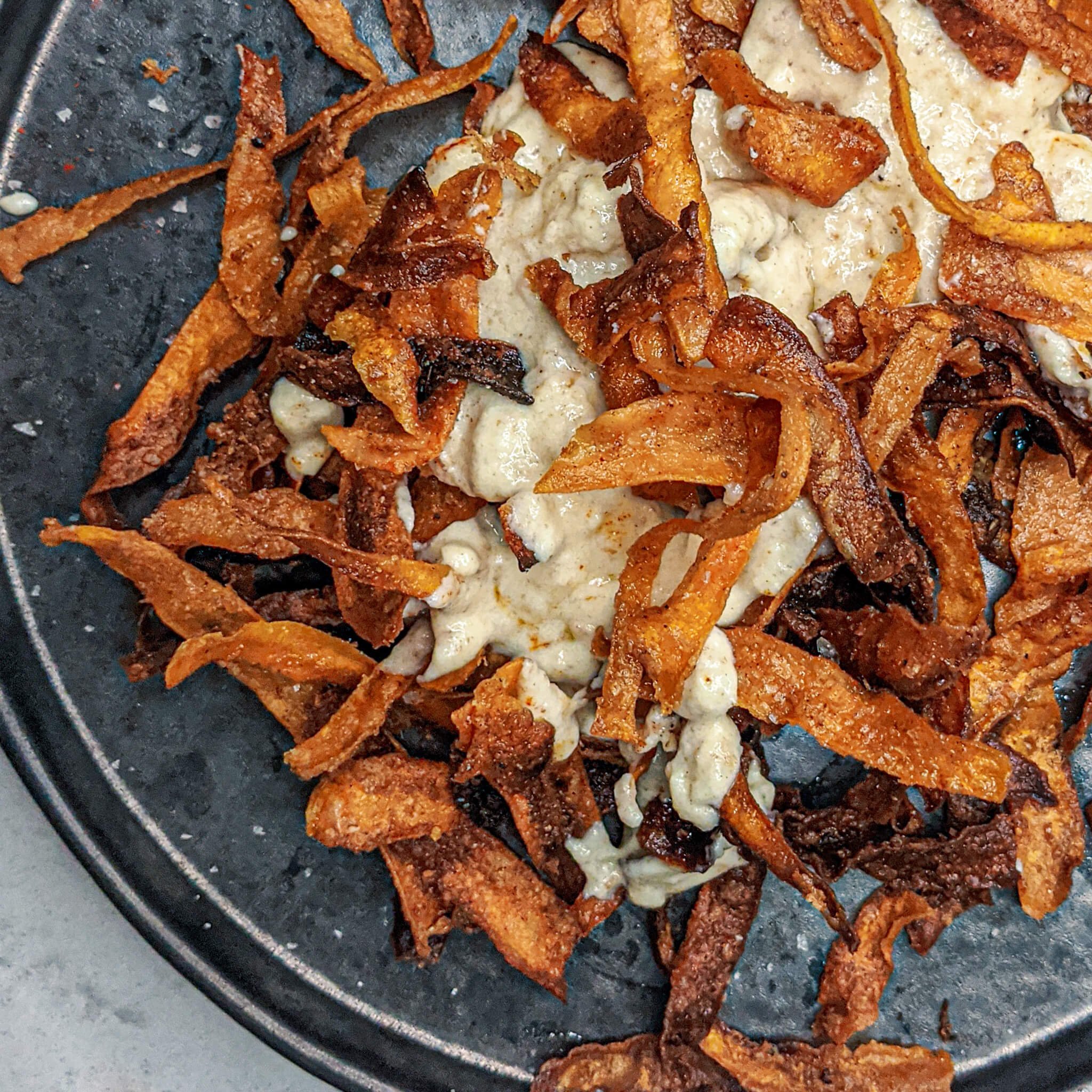 Southern fried carrots and cheese rind sauce