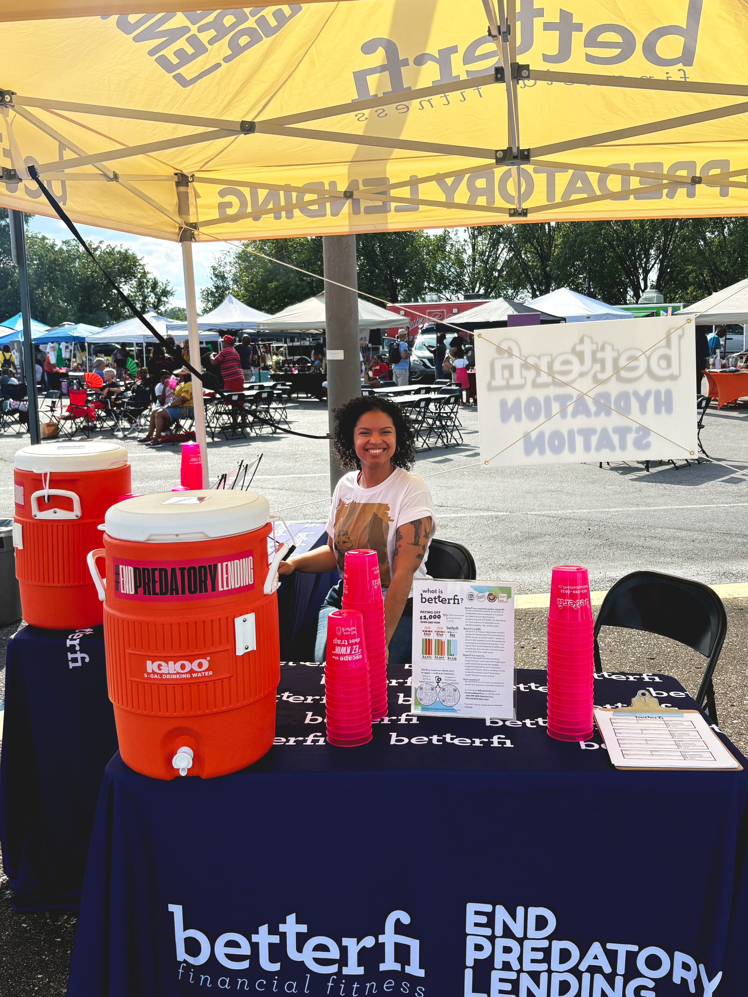 BetterFi's Winny holding down the hydration station at Juneteenth