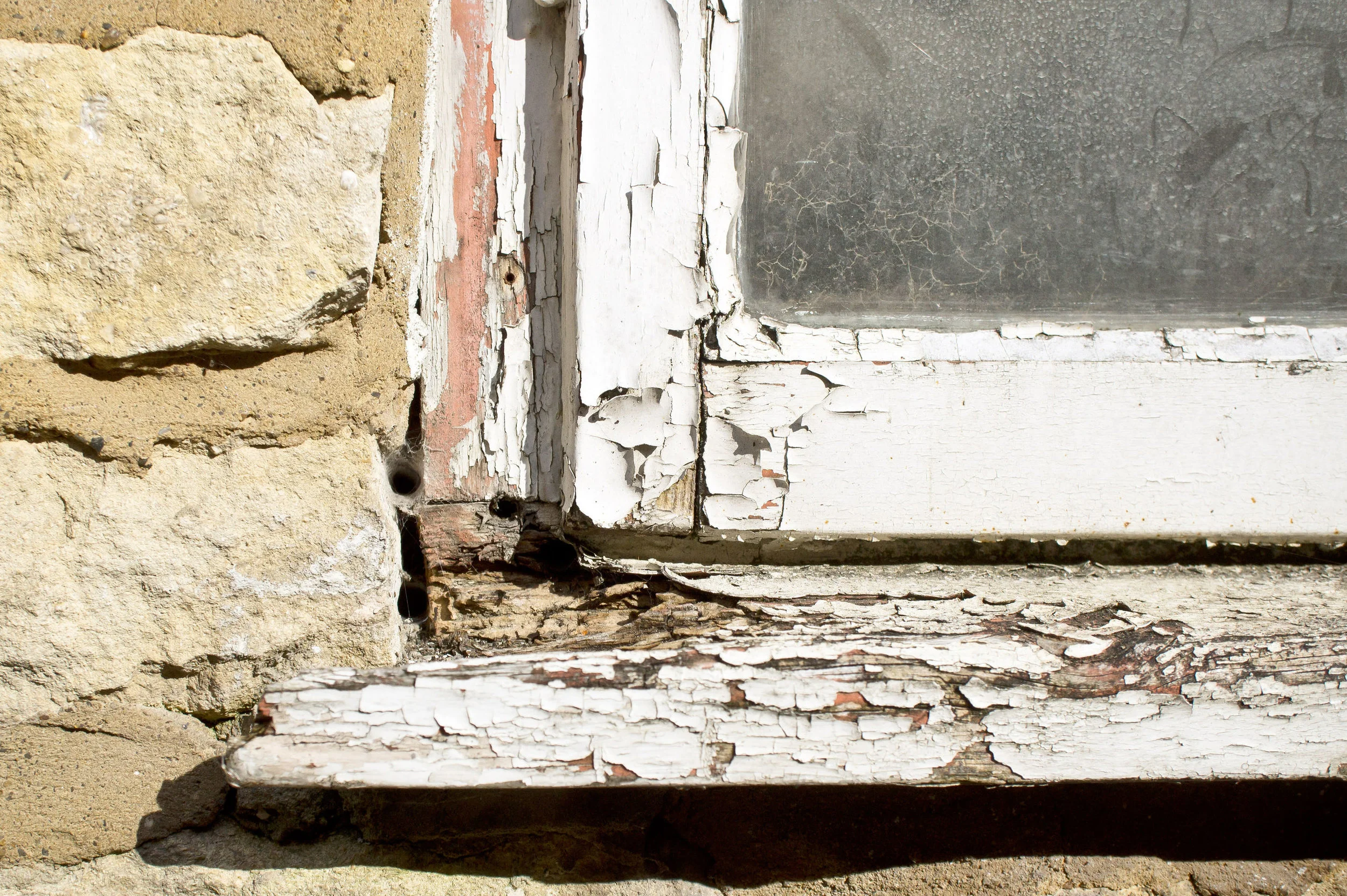 Rotting Wood is a tell tale sign that water damage has occurred and probably traveled beyond that point.