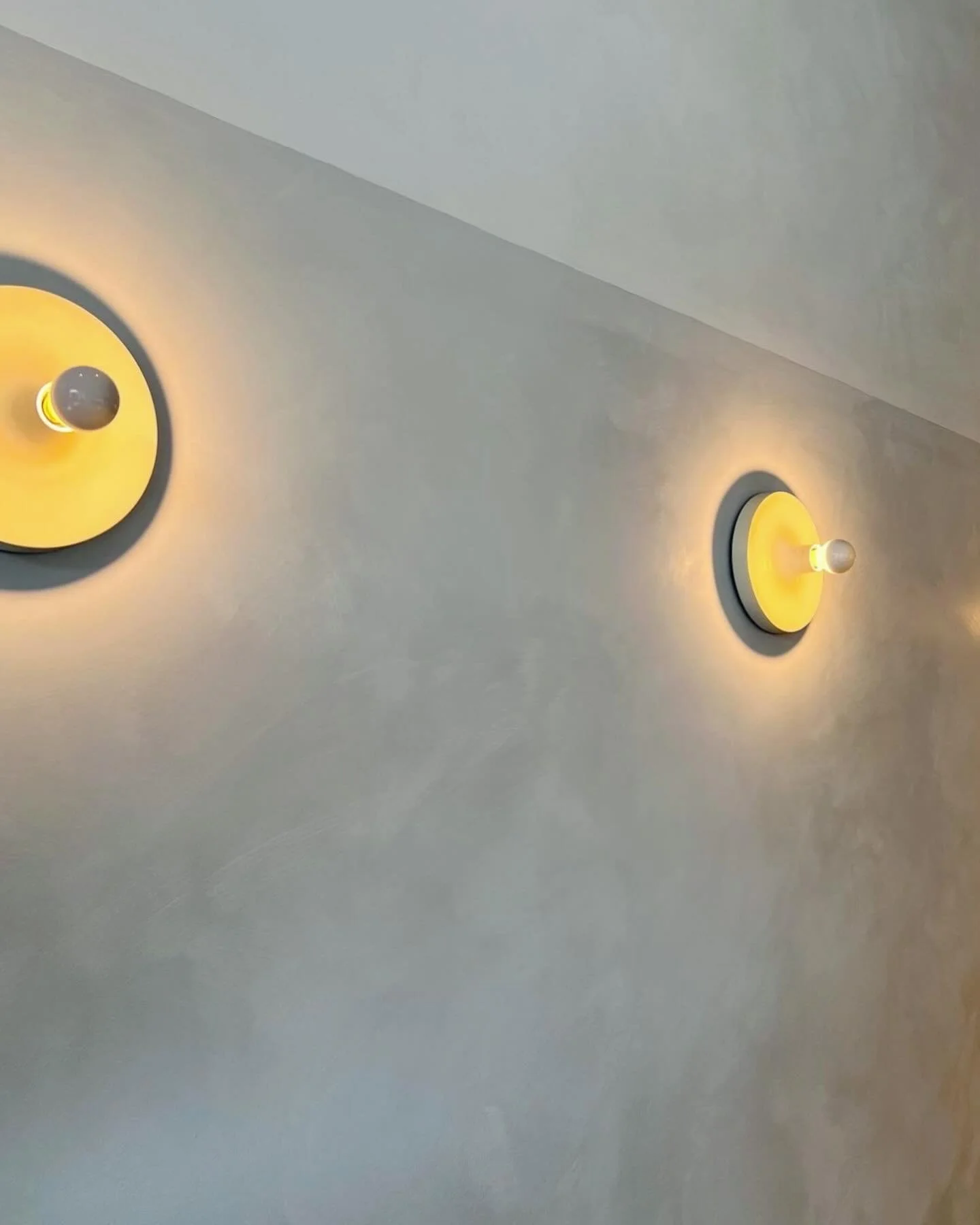 Two tone lime wash in warm grey is punctuated with the perfect vintage fixture. #charlotteperriand #limewash #luxury @lifestorybeauty @pacificsolutionscontracting @foselectricsystems