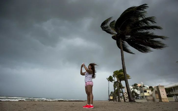 Student trying to find a signal during Hurricane Irma.