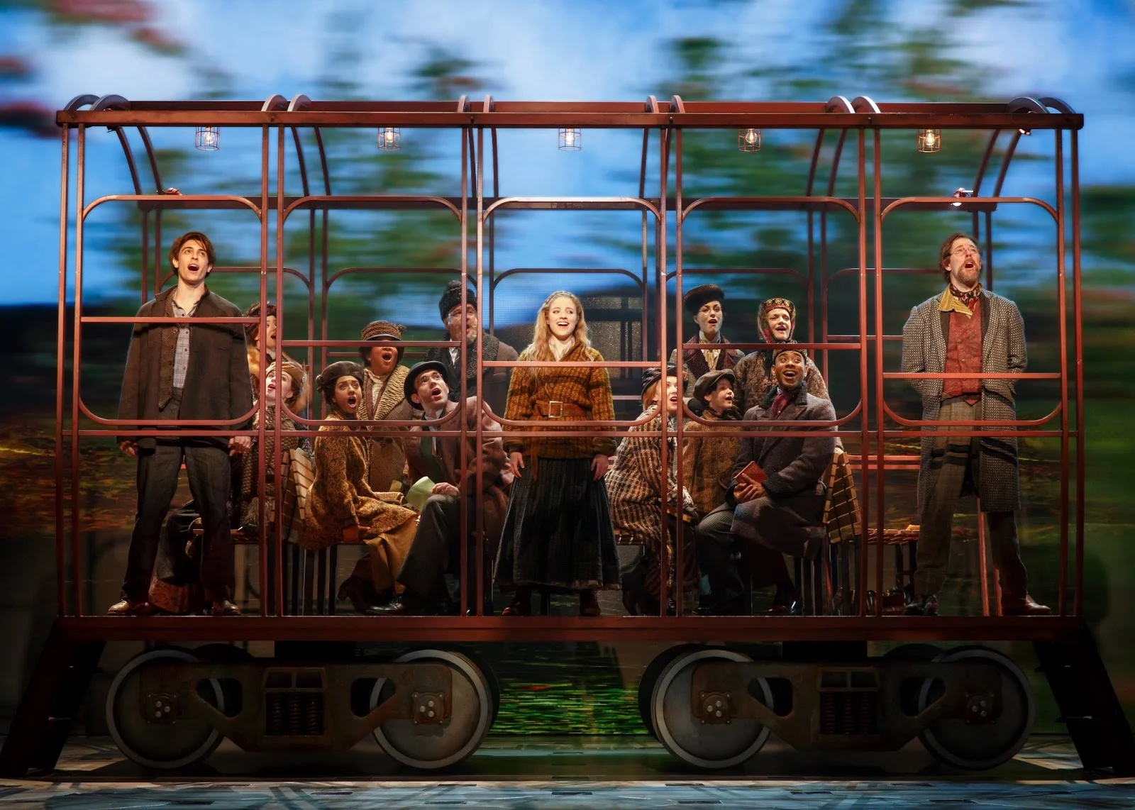 One of the Larger Set Pieces, this Train Car Hangs from the Ceiling Stage Left and is Lowered Down and Tracked On Stage Nearly Silently During Intermission