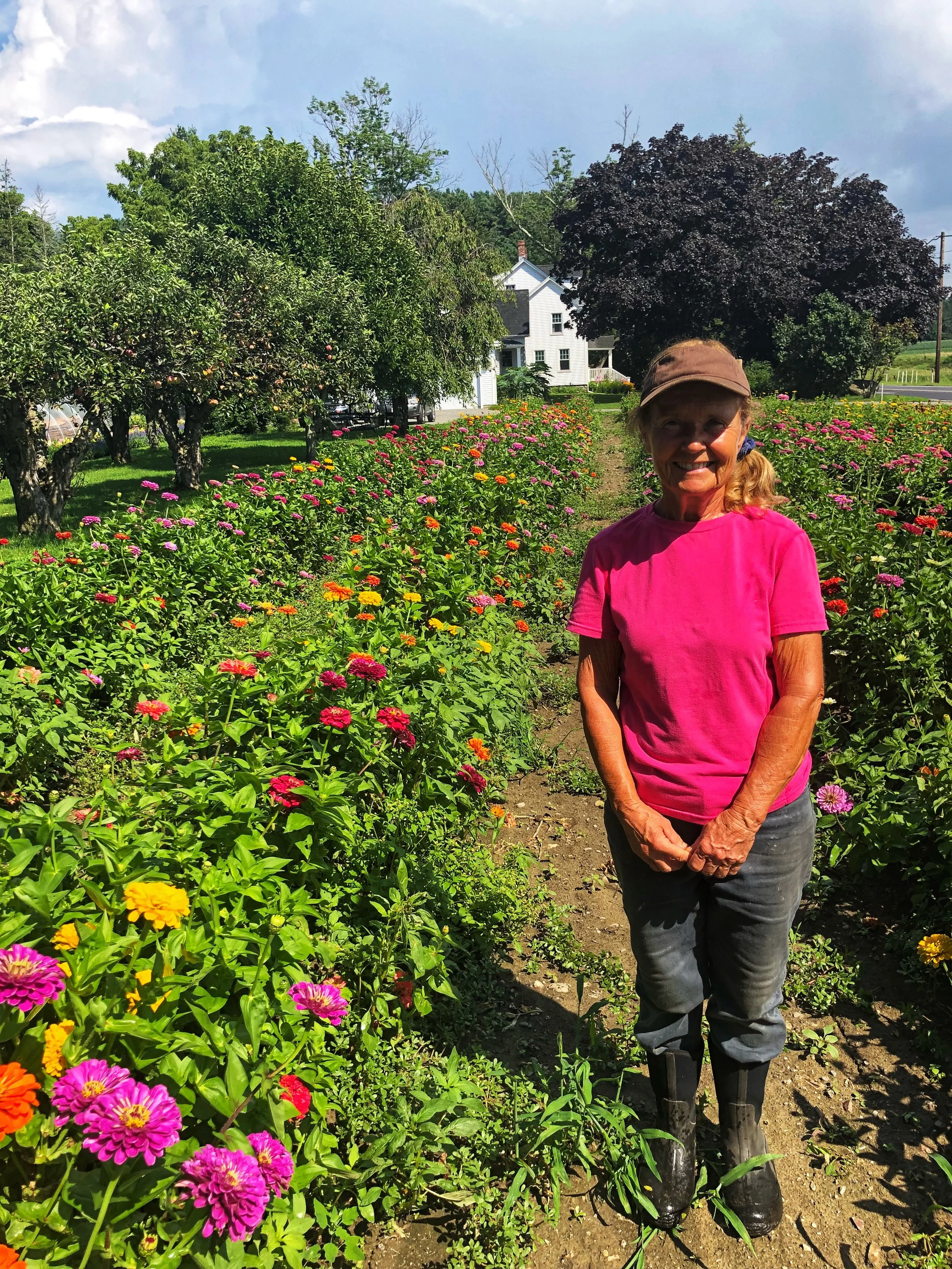 Susan Macone in her field of flowers.