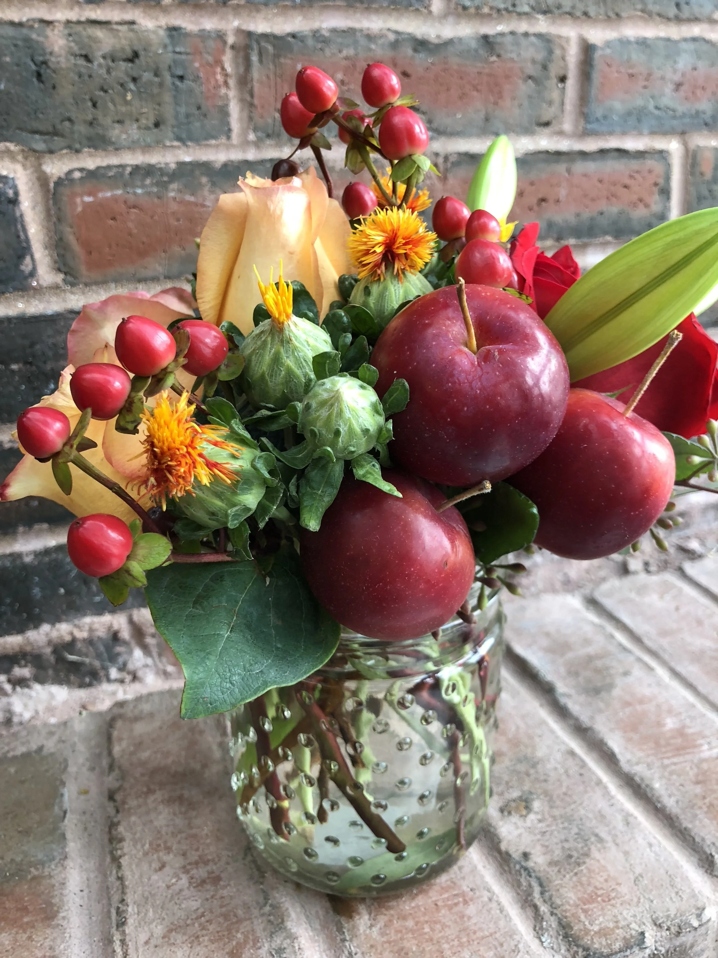 Flower arrangements made with flowers and crab apples!