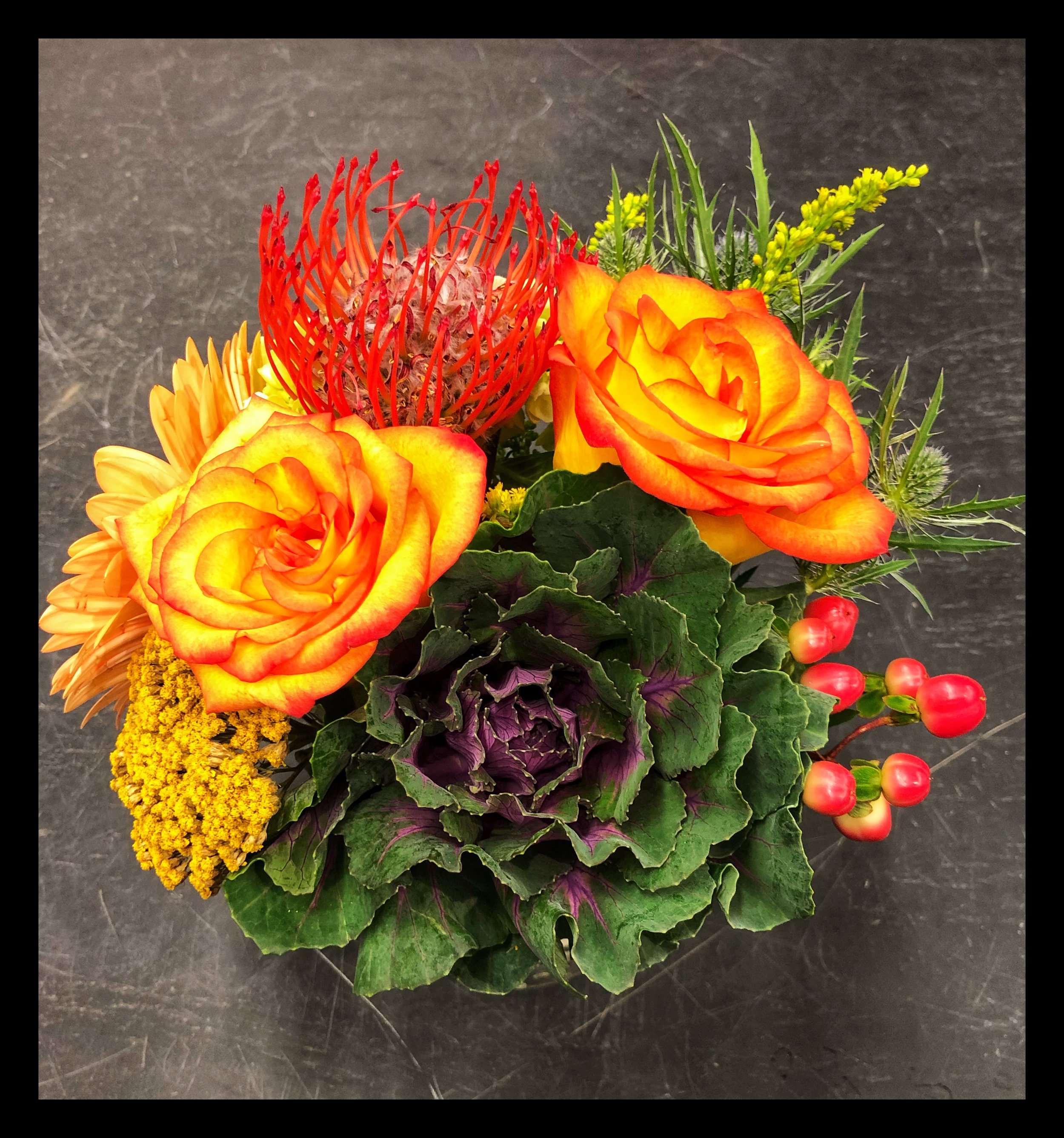 Roses and kale stem flower arrangements at Russo’s