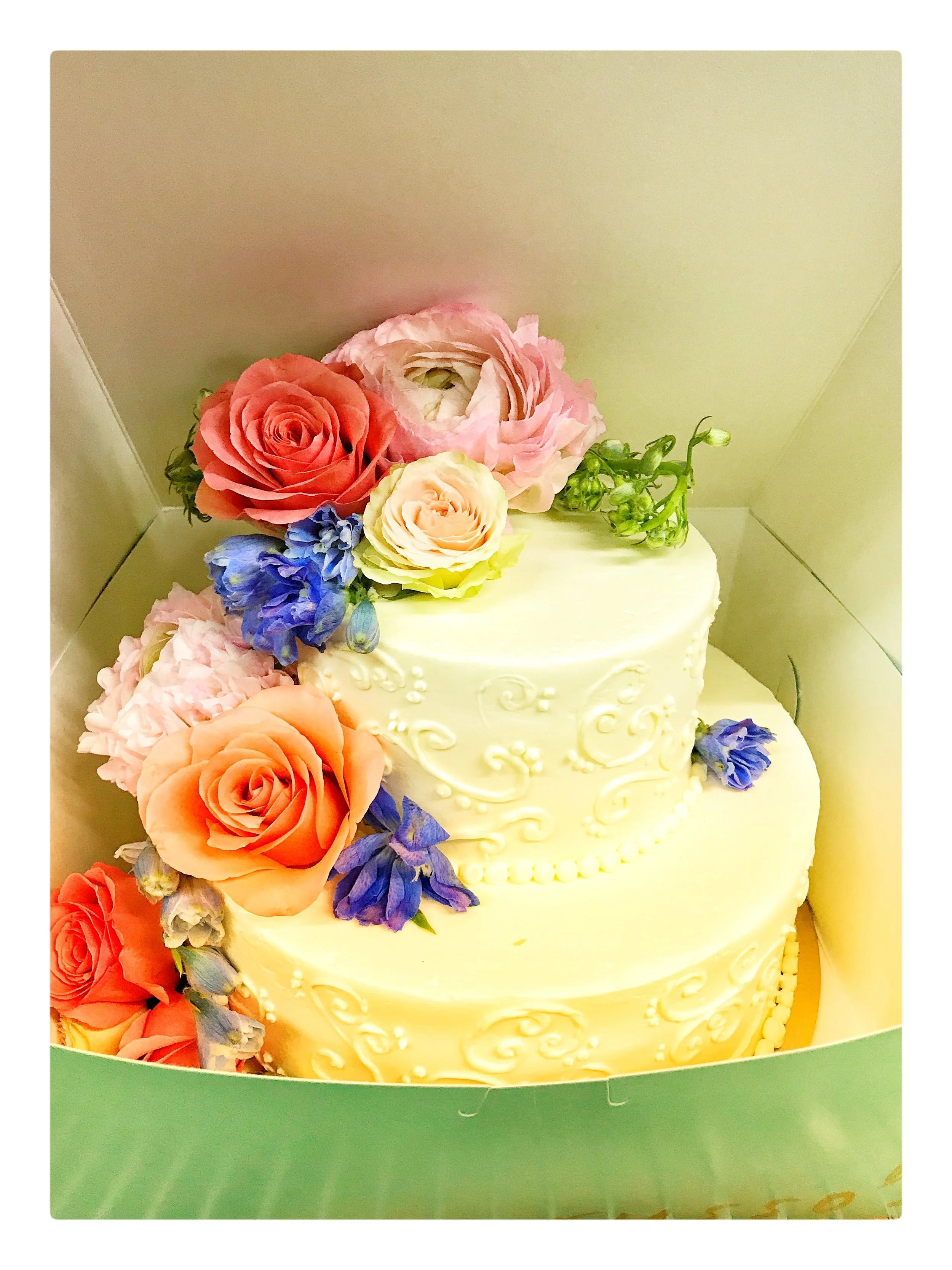 Cake decorated with fresh flowers for a special event in Boston.