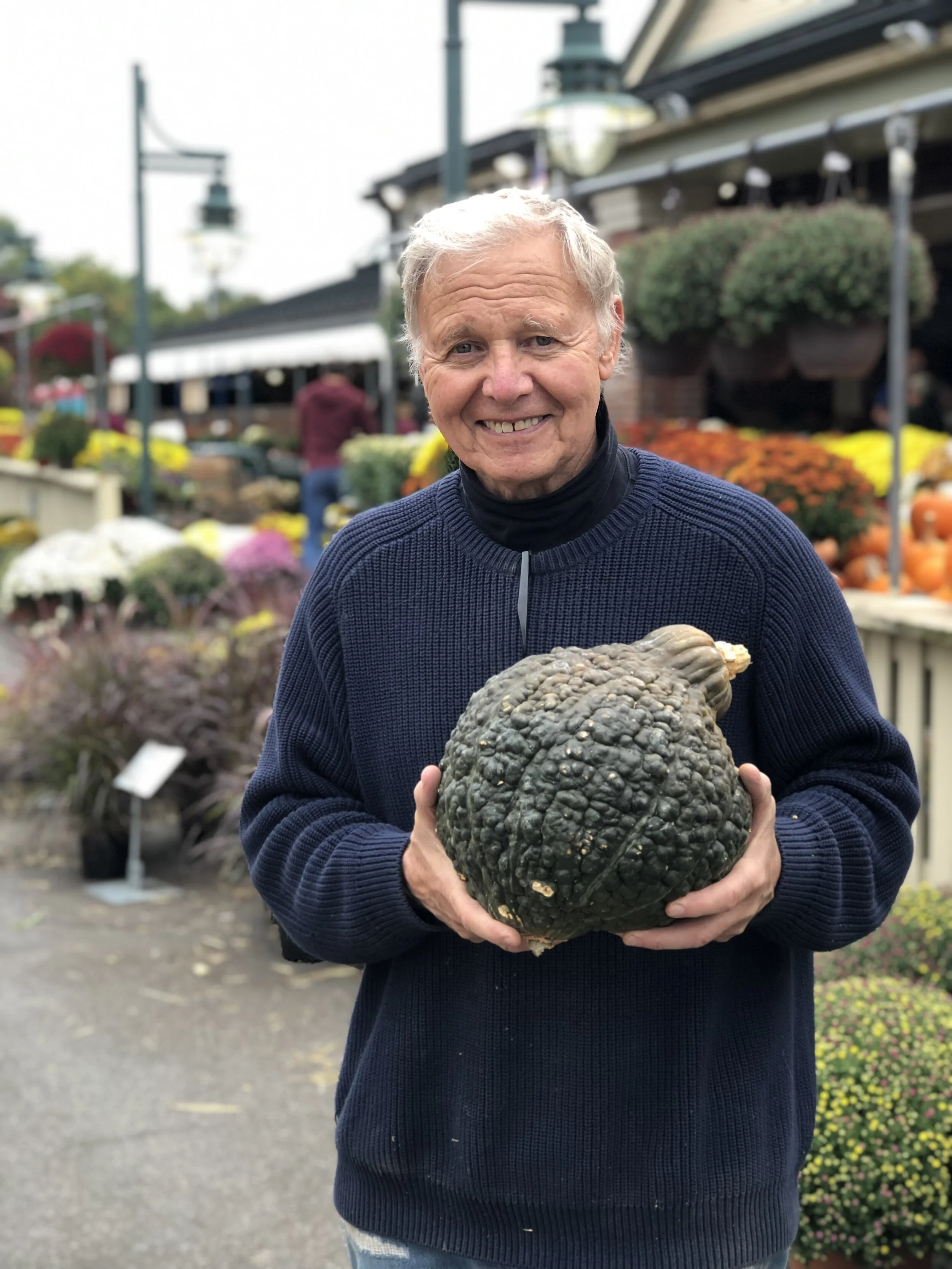 Tony Russo with Black Hubbard squash which is edible, delcicious and perfect for decorating this time of year!