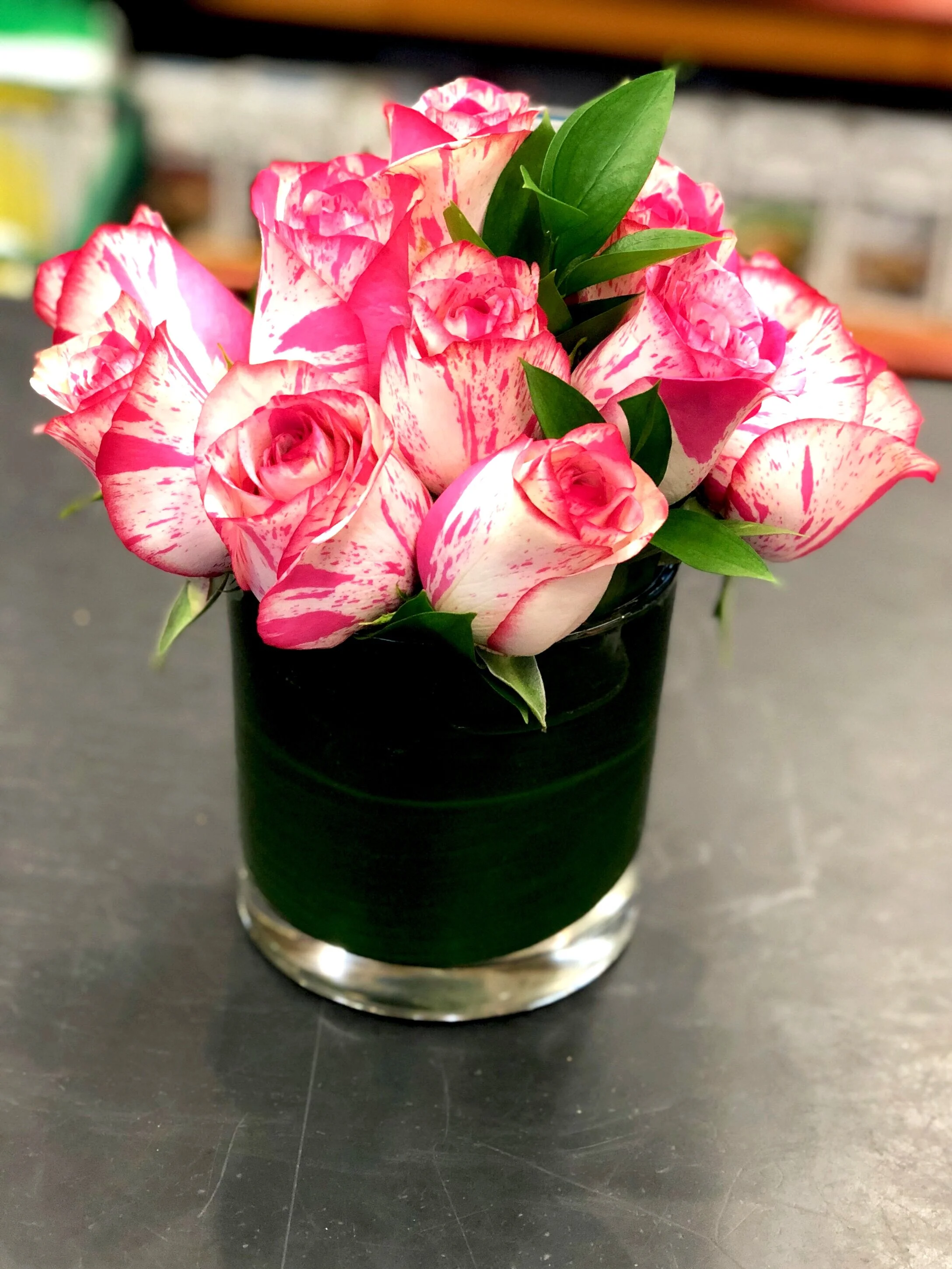 White-with-pink roses create a dramatic display for the holiday!