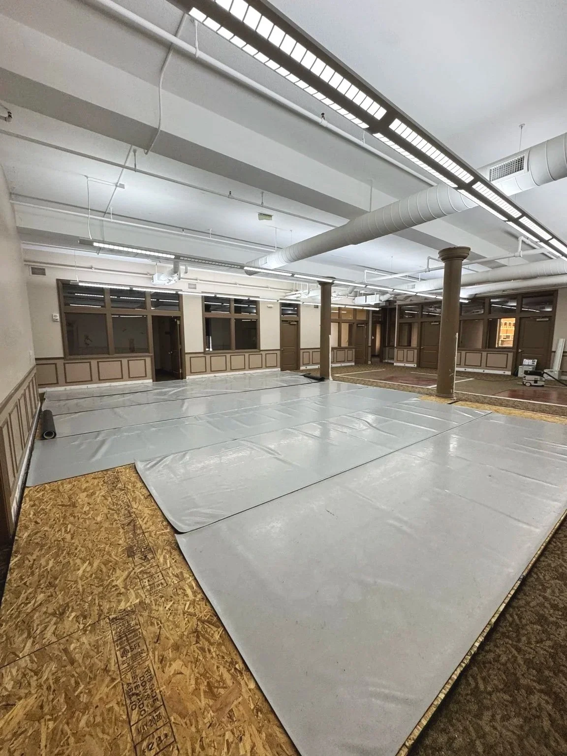 Professional Marley dance flooring being installed in the future Kalamazoo Ballet studio