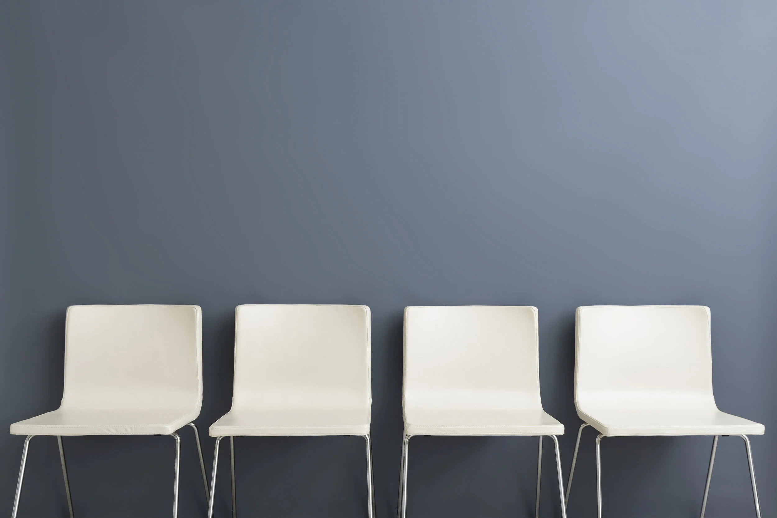Chair-background-concept---recruitment-hire-hiring-interview-628279378_4697x3131.jpeg