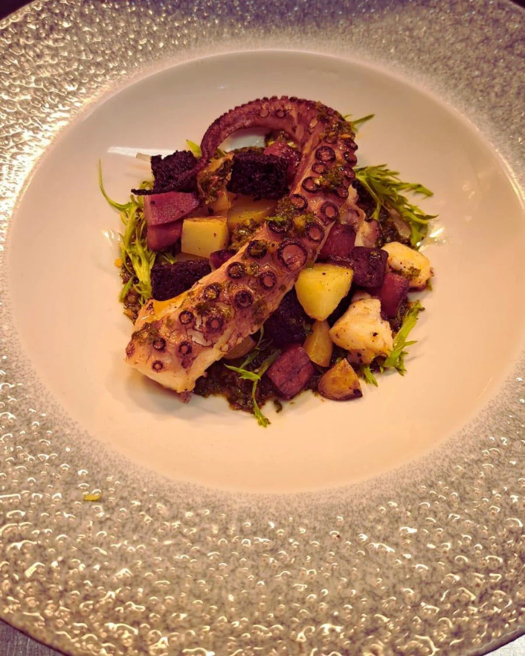 🐙 We eight it up! 🔥 

Ink-redible flavours  in our Grilled British octopus with chorizo, Stornoway black pudding, new potatoes, and chimichurri bringing it all together.

Part of our brand new Spring/Summer menus - &agrave; la carte, lunch, pre-the