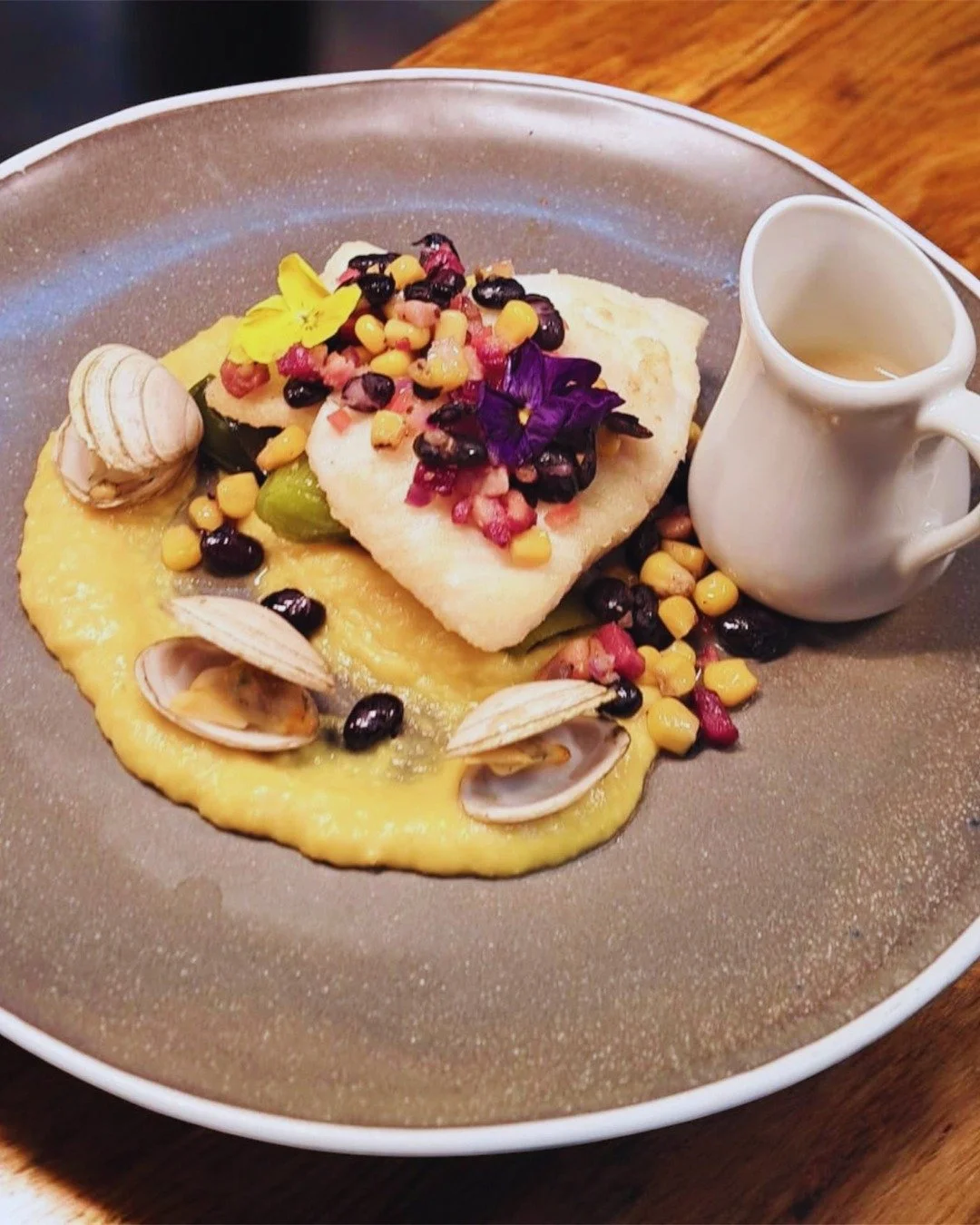 Clam-tastic!

Wild halibut, paired with sweet clams, silky corn pur&eacute;e, and delicately braised baby leeks. Rich black bean succotash with pancetta, finished with a classic sauce bercy.

#gambaglasgow #glasgowfood #seafoodrestaurant #halibutdish