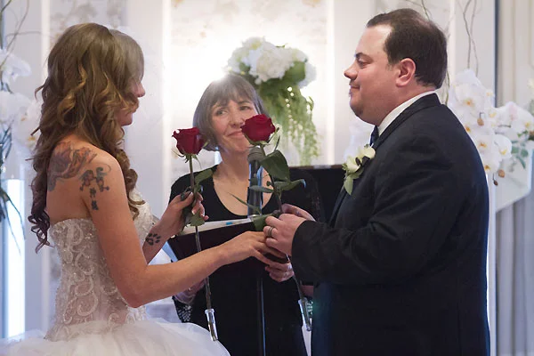  ROSE EXCHANGE CEREMONY – Giving their first gifts as husband and wife  photo ©    R. Becker Creative   