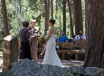 Couple exchange vows in the outdoor chapel at Bluebell Lodge