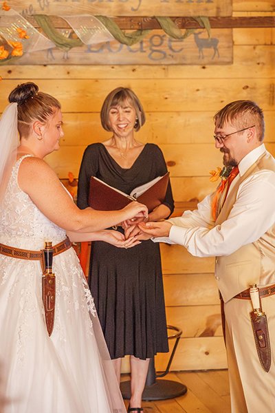  PAYING FOR DAGGERS – “Purchasing” their exchanged daggers with rings  photo ©    Sienna Summers Photography   