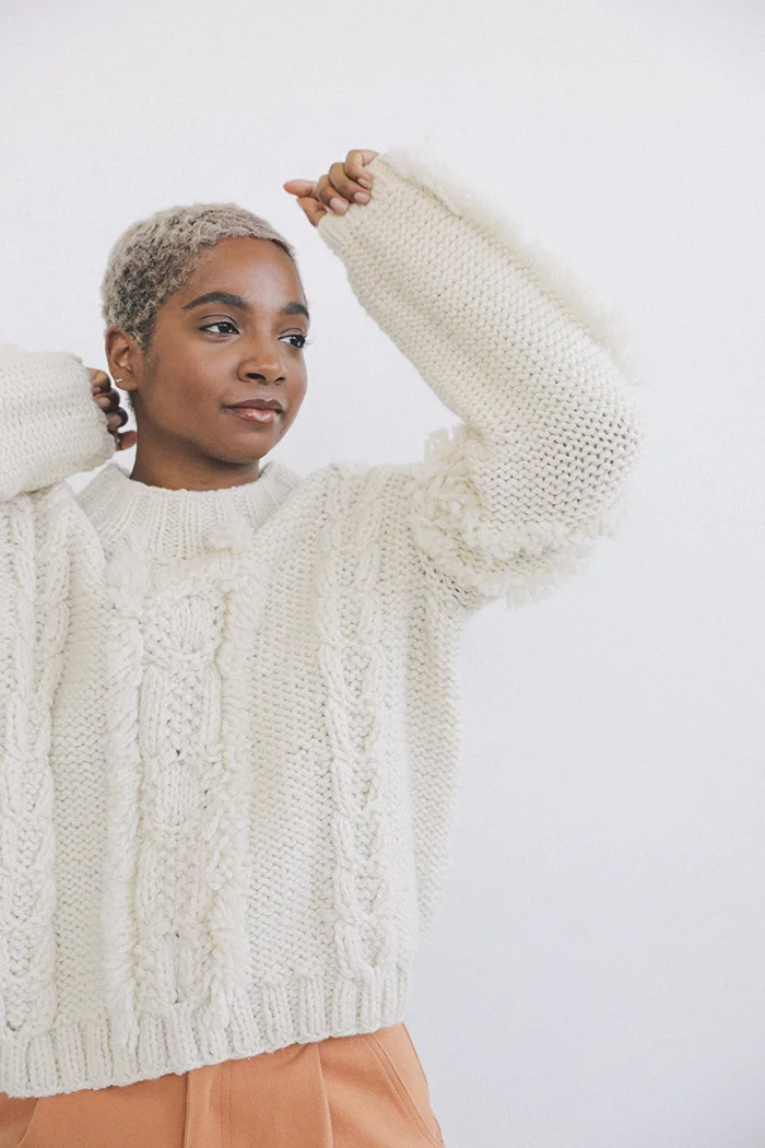 kordal alpaca eco wool fringe cable sweater cream sustainable fashion product photography