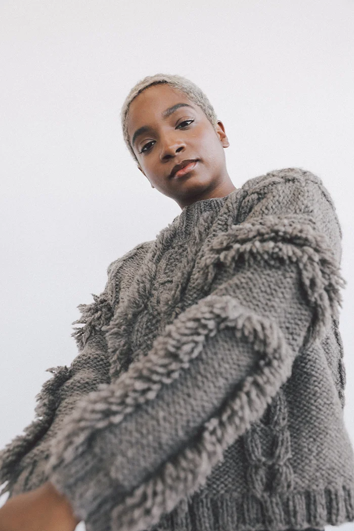 kordal alpaca eco wool fringe cable sweater cream sustainable fashion product photography