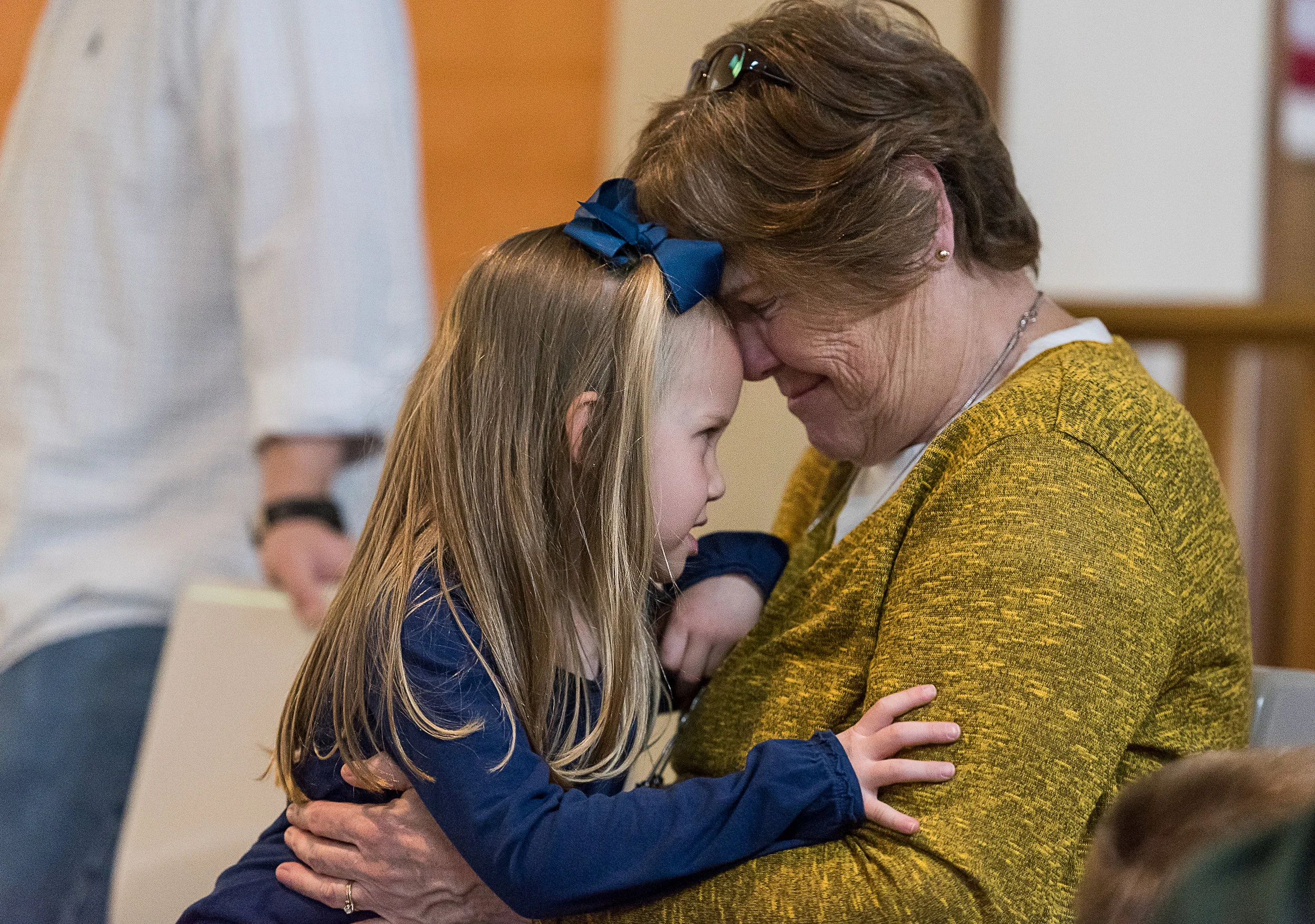 Meredith Dunlap embraces her grandmother, Pat Warneke, at Rollerbowl Lanes in Athens, Ohio on Feb. 19, 2017. Dunlap and her immediate family are from Proctorville, Ohio and came to Athens with her grandparents from Sugar Grove, Ohio for a day of family fun.