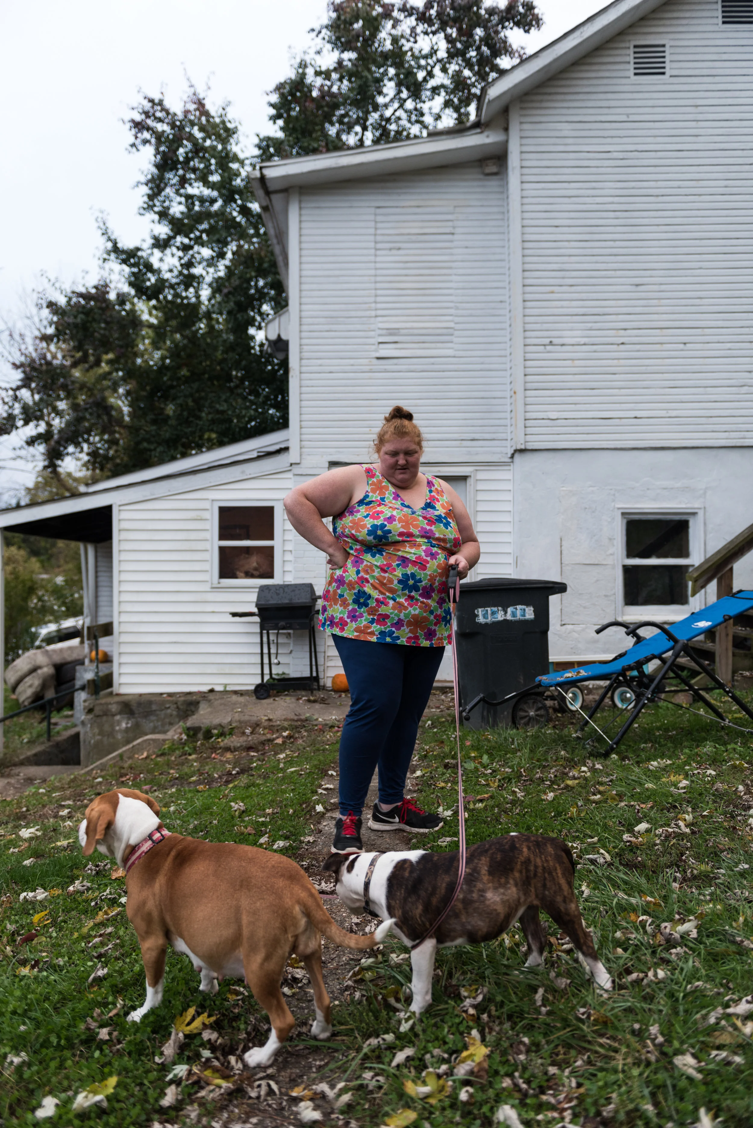 Perkins takes her dogs (left to right) Maggie May and Brigit outside their basement apartment on October 30, 2017. Maggie May’s water had broken a few hours before.