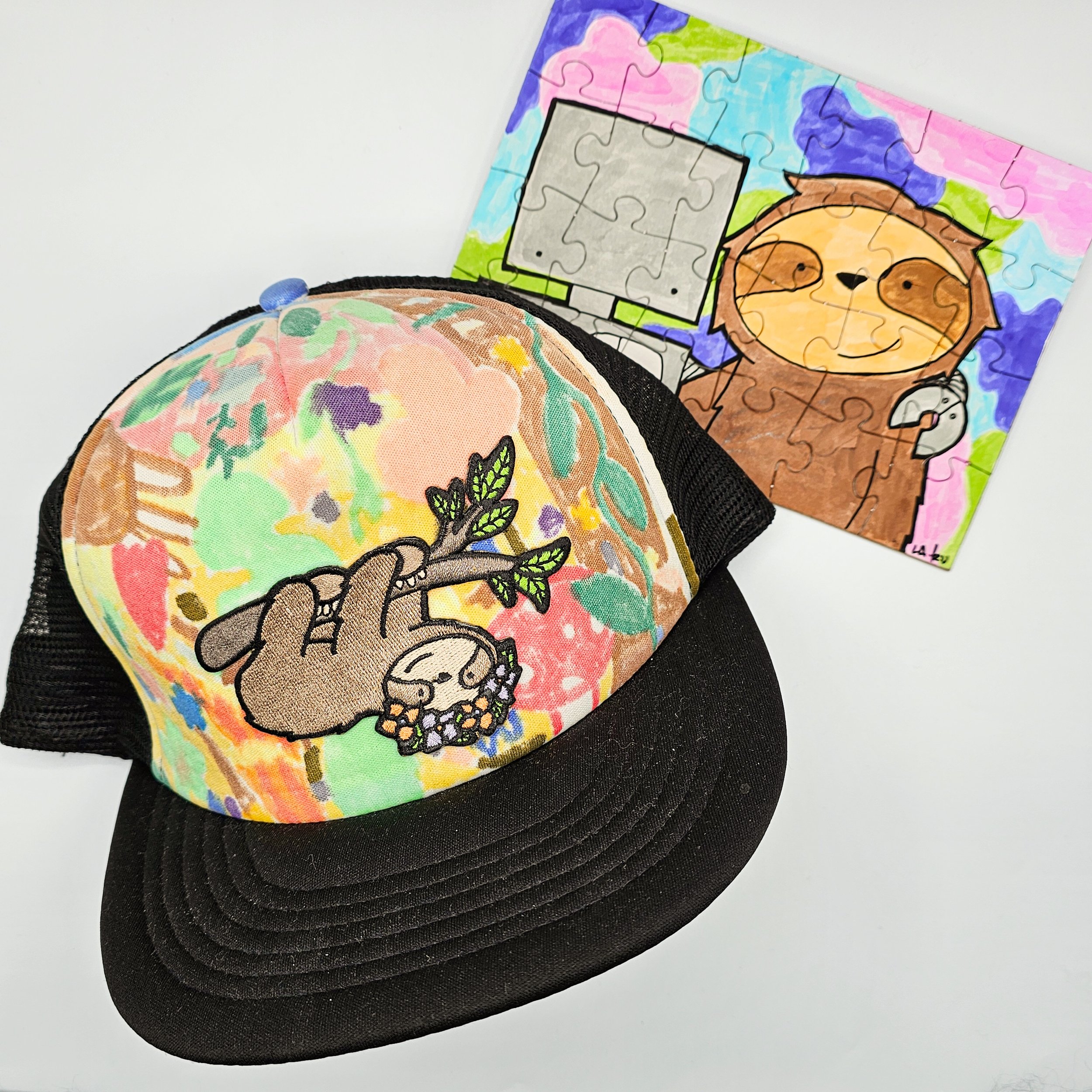 Colorful collection of children's toys including pink sunglasses with rainbow sprinkles and purple beads, a keychain with a girl and animals, a green mirror with textured surface, a plastic hair clip with bunny and leaves, and a drawing of a buffalo with a flower crown.