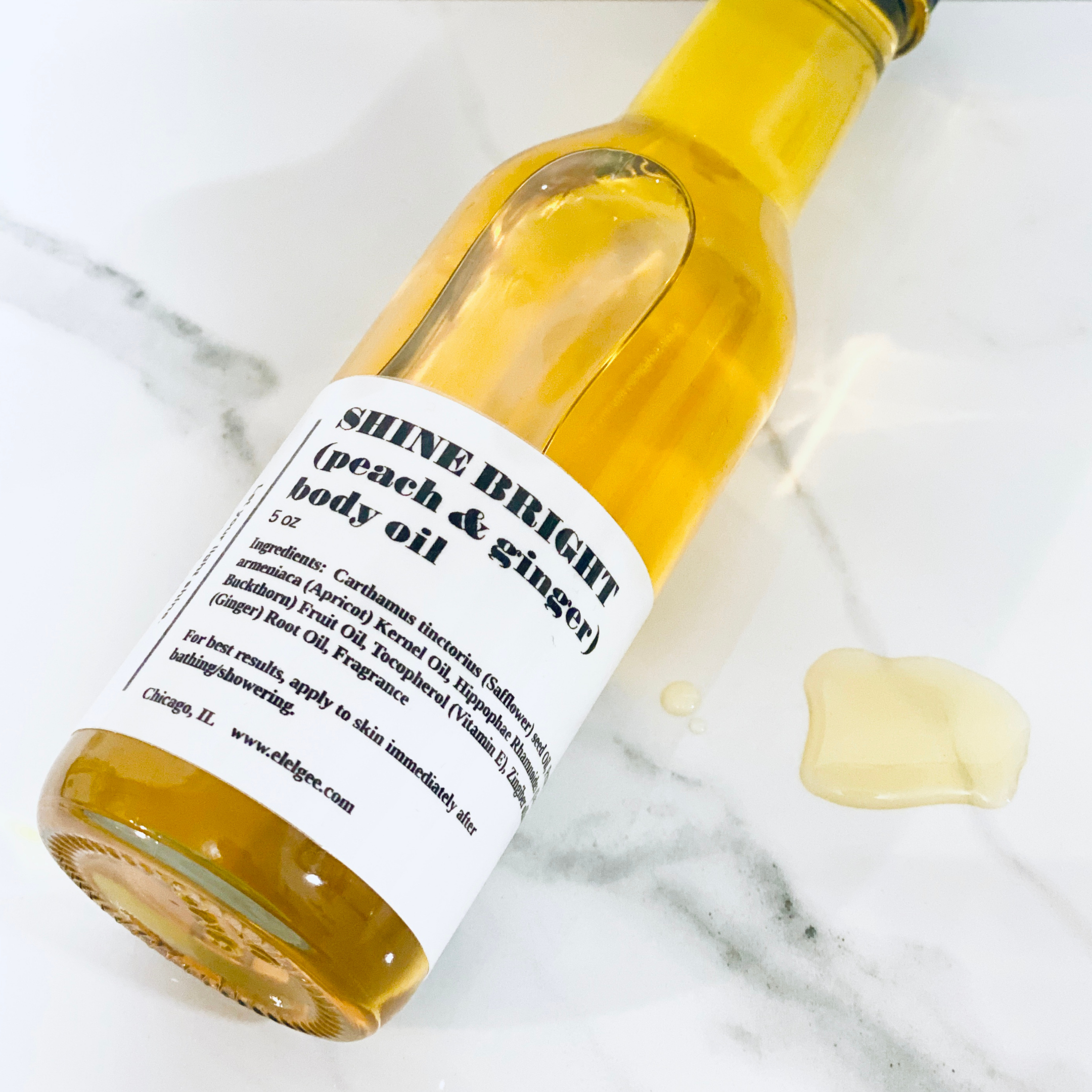 shine bright body oil drip.png