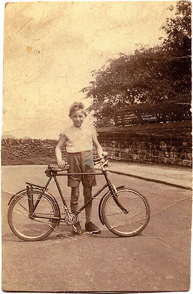 Brian as a young lad with his treasured Raleigh bicycle.