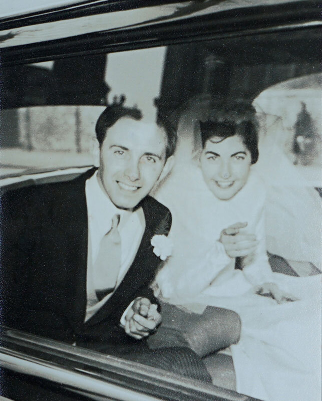 Aurelie-and-Brian-Wildsmith-leave-wedding-ceremony-in-car.jpg