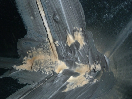 Figure 1:The water-based mastic stayed wet (tacky to the touch) for weeks because the covered ductwork did not allow the mastic to dry, resulting in mold growth.