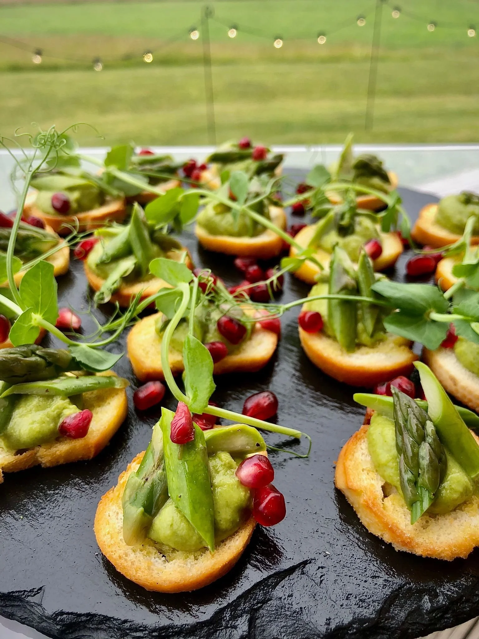 Asparagus Crostini with Pea puree and pomegranate.jpg