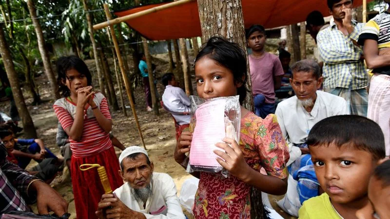 Rohingya children waiting for their parents in order to receive aid. (Tracey Nearmy / EPA-EFE / REX / Shutterstock)