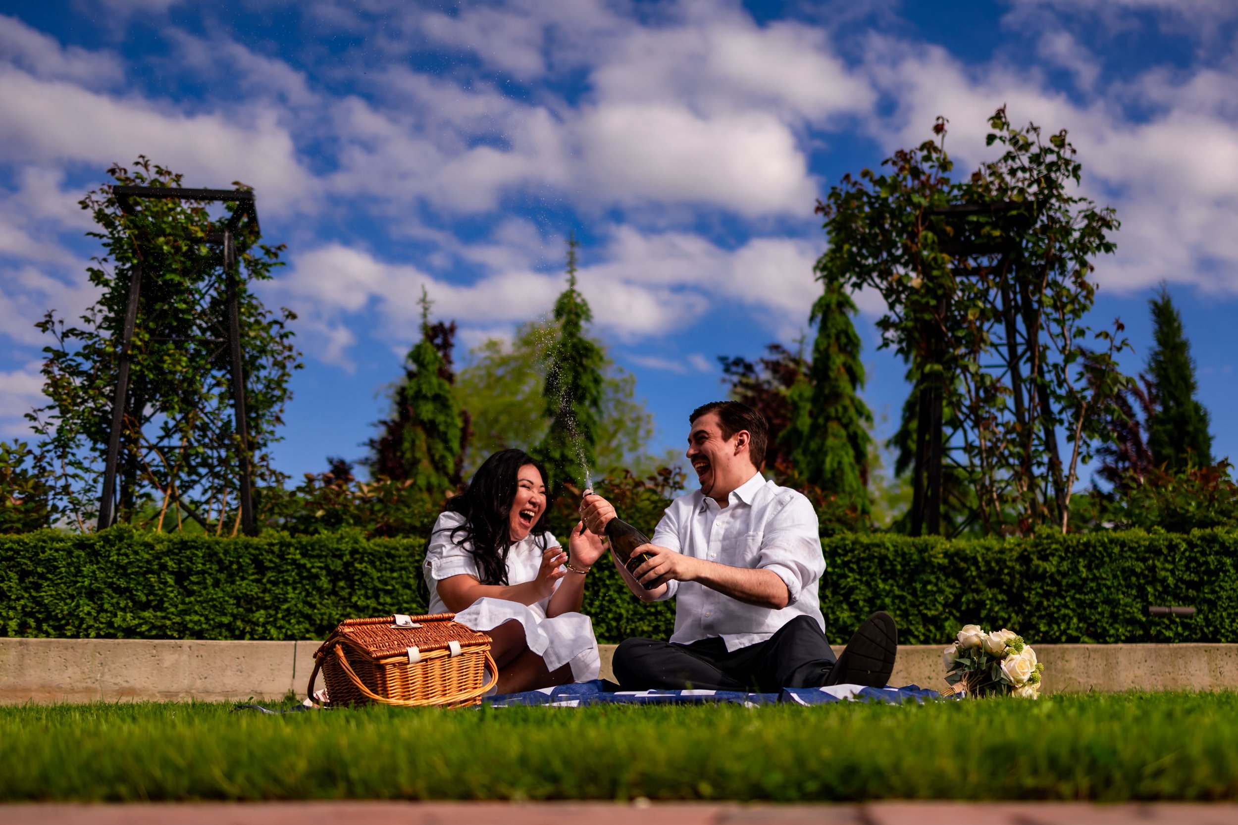 Fun engagement photo Niagara on the Lake champagne couple candid