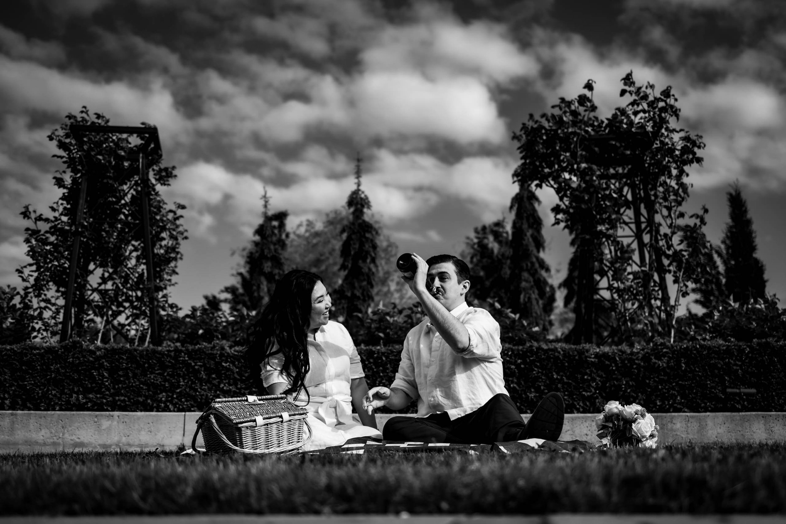 Black and white engagement photo champagne candid Niagara on the Lake