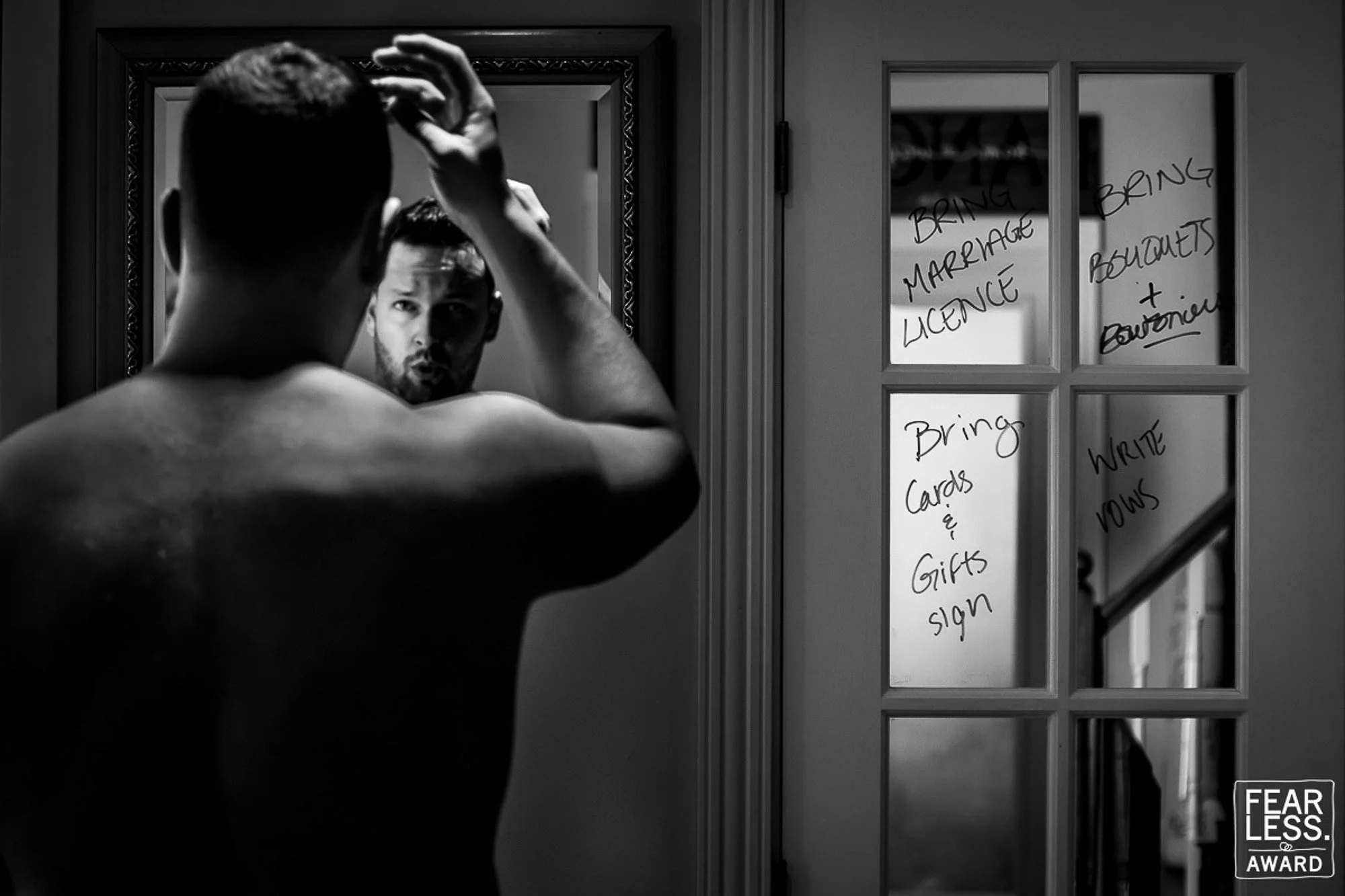 groom getting ready mirror reflection candid moment fearless award wedding photography