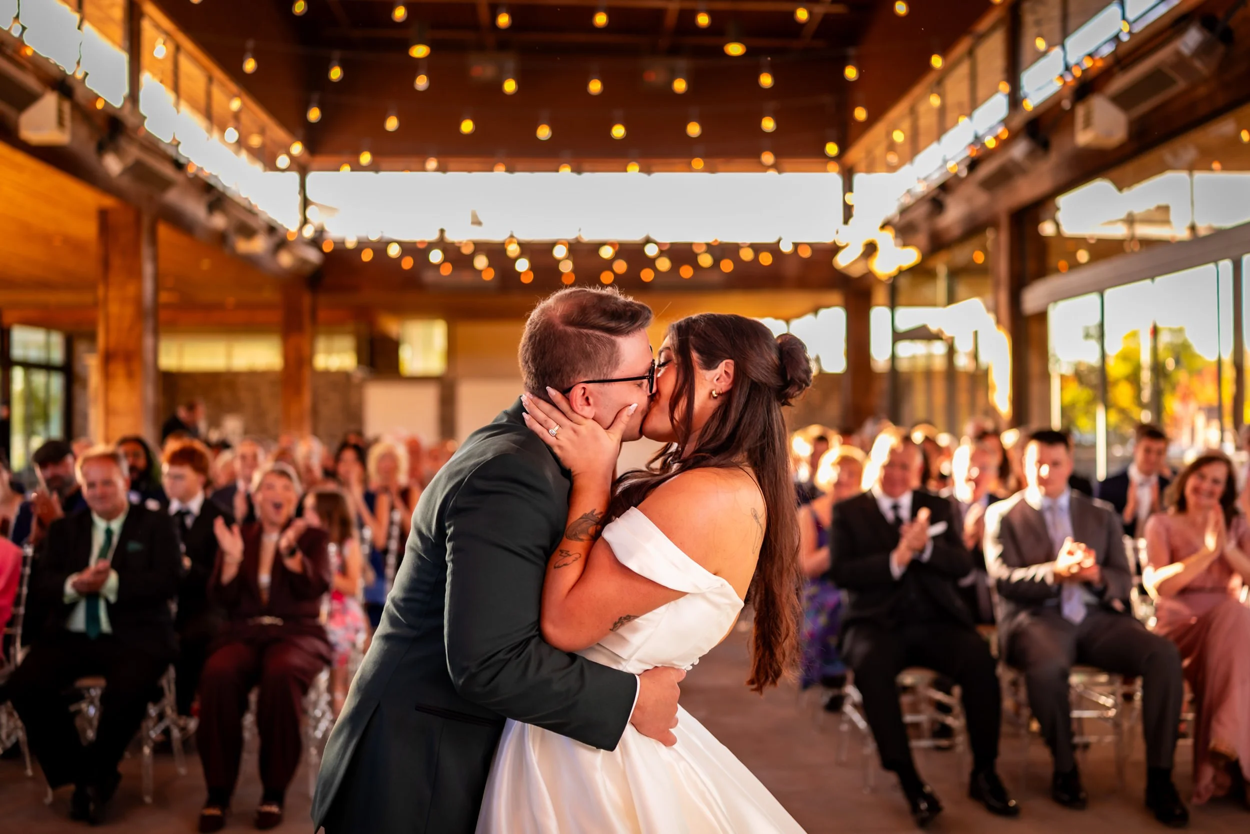 Bride and groom sharing their first kiss at The Guild Inn Estate wedding venue in Scarborough