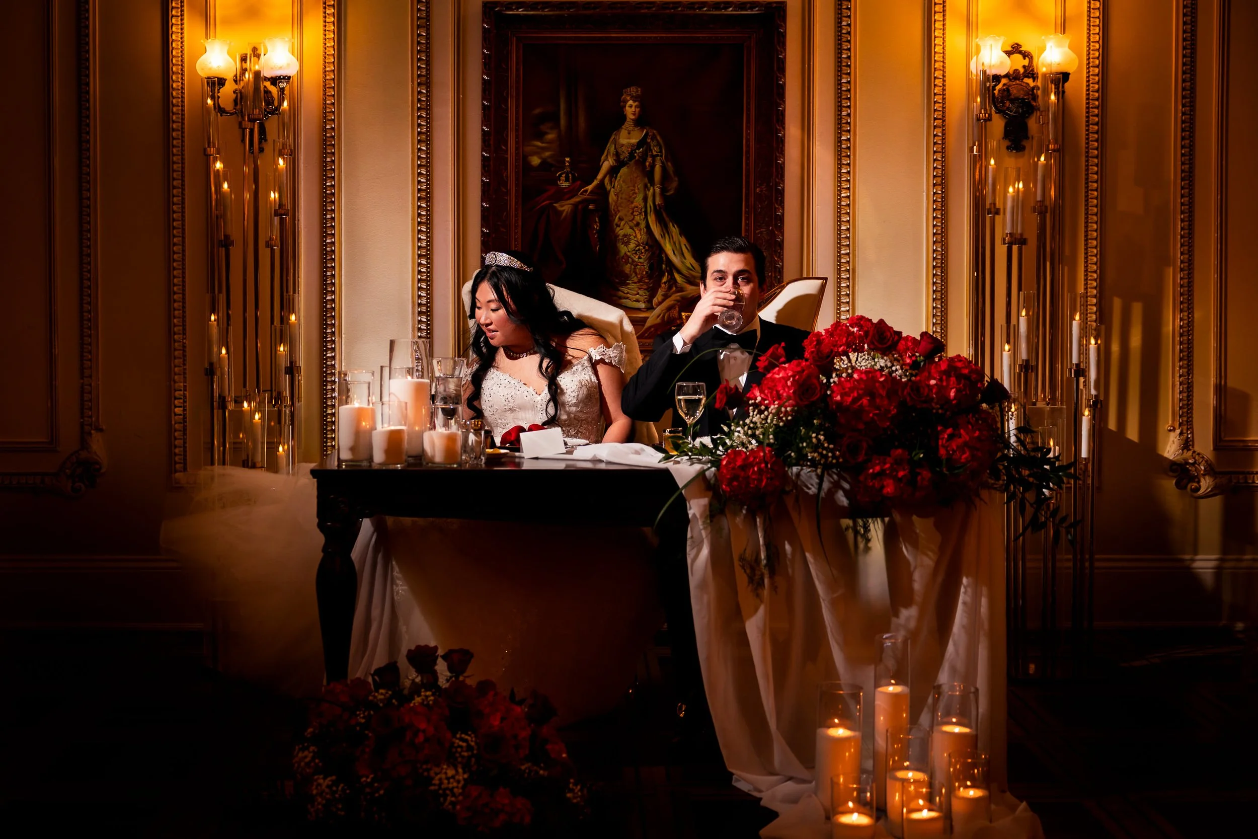 Bride and groom seated at their candlelit head table during a romantic Valentine’s Day wedding reception at Prince of Wales Hotel in Niagara on the Lake
