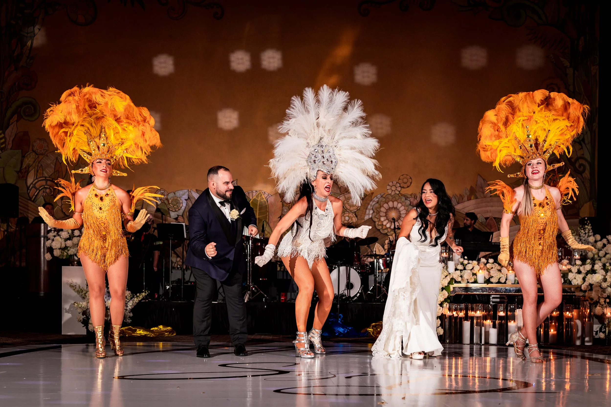 eglinton grand wedding reception with samba dancers performing on dance floor in toronto bride and groom celebrating with live entertainment