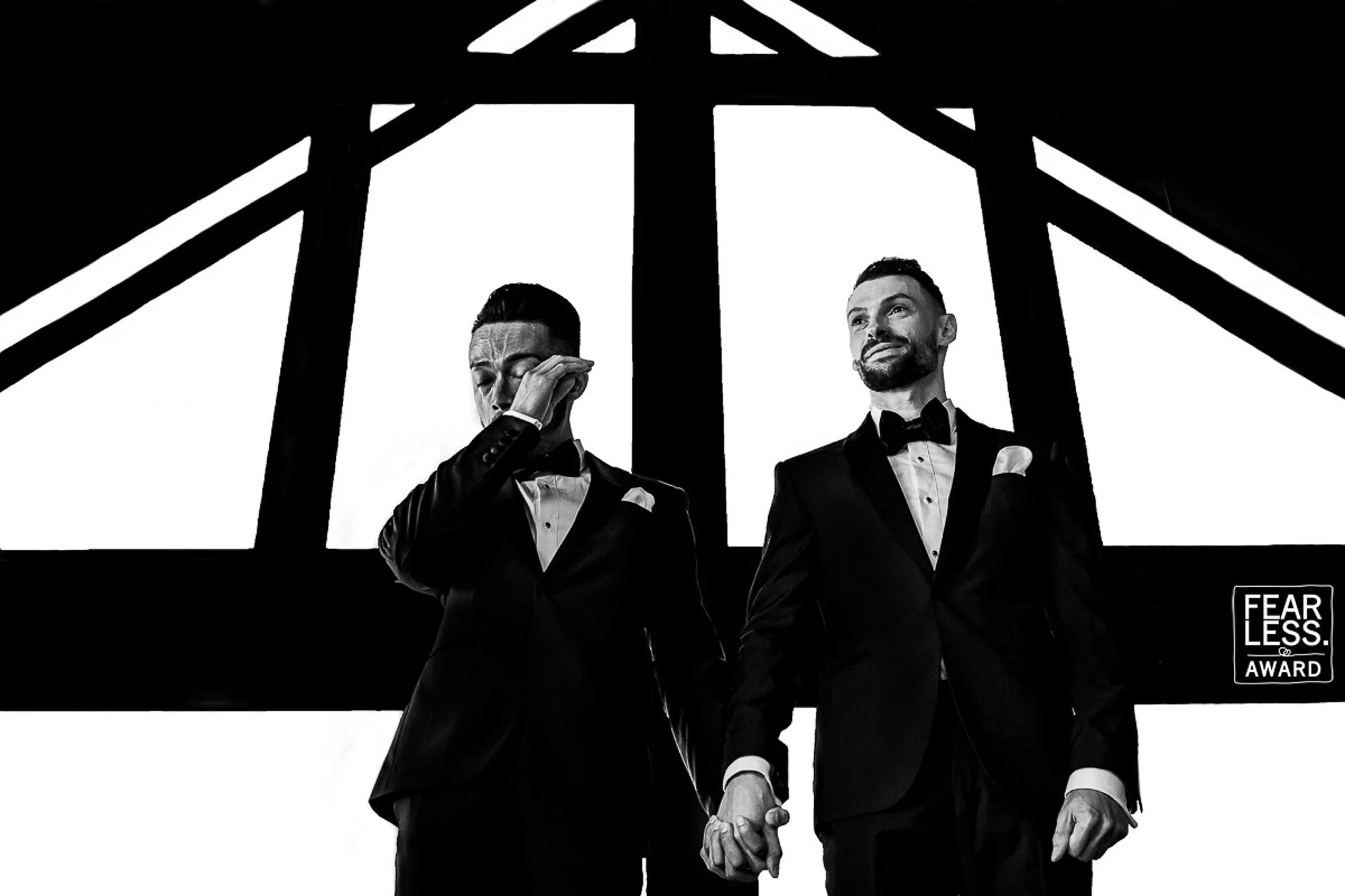 groom emotional moment black and white fearless award same sex wedding photography candid