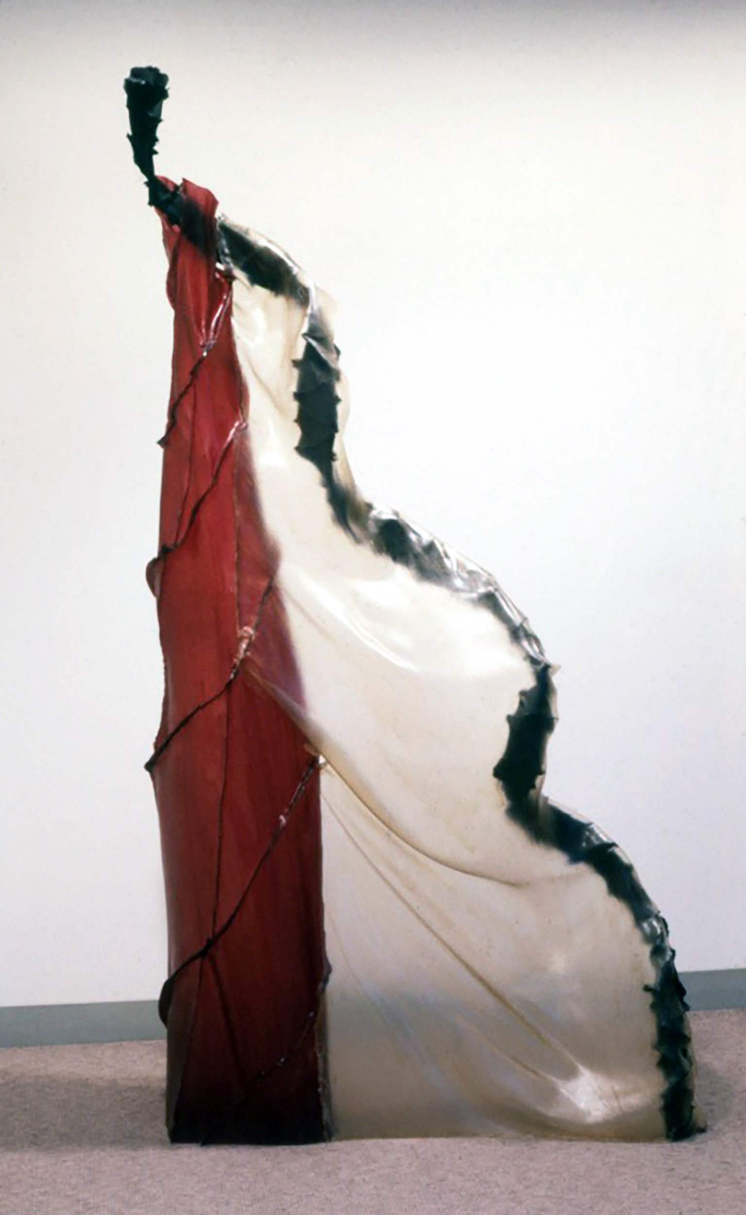  T.T., 1984, fiberglass cloth and polyester resin, 92 x 56 x 18 inches  With a couple of exceptions, the sculptures play a twisting, upward movement off a still, vertical core - actual or implied - like a vine twining around a tree, though in the scu