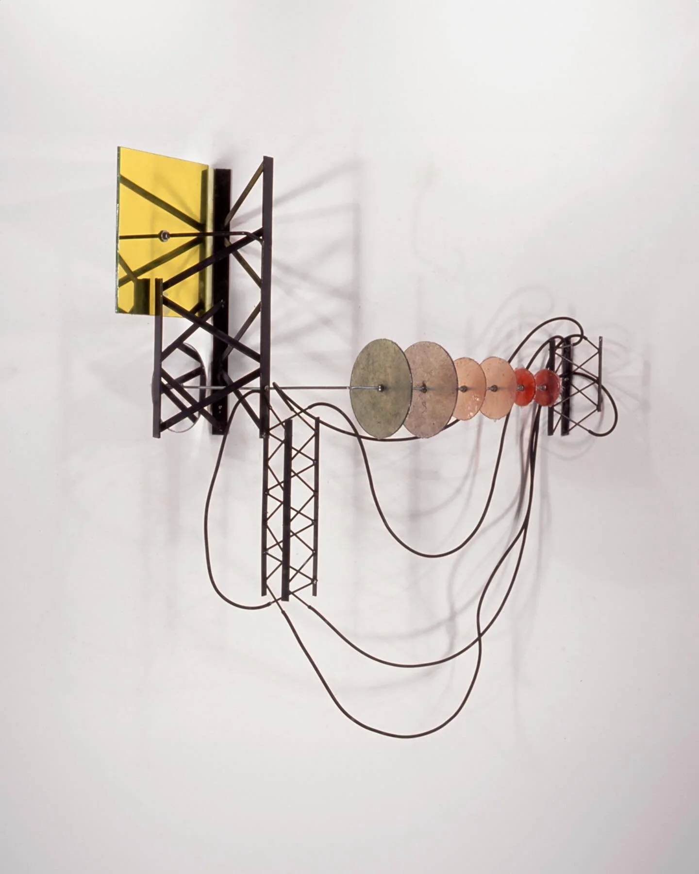 Fits and Starts 2000
2&rsquo; 4&rdquo; x 2&rsquo; 7&rdquo; x 8&rdquo;
steel, fiberglass discs, dyes, acrylic mirror, rubber tubing

#jaffefriedestraussgalleries
#dartmouthcollege
#tombutter 
#artofthetwothousands
#abstractsculpture
#geraldauten