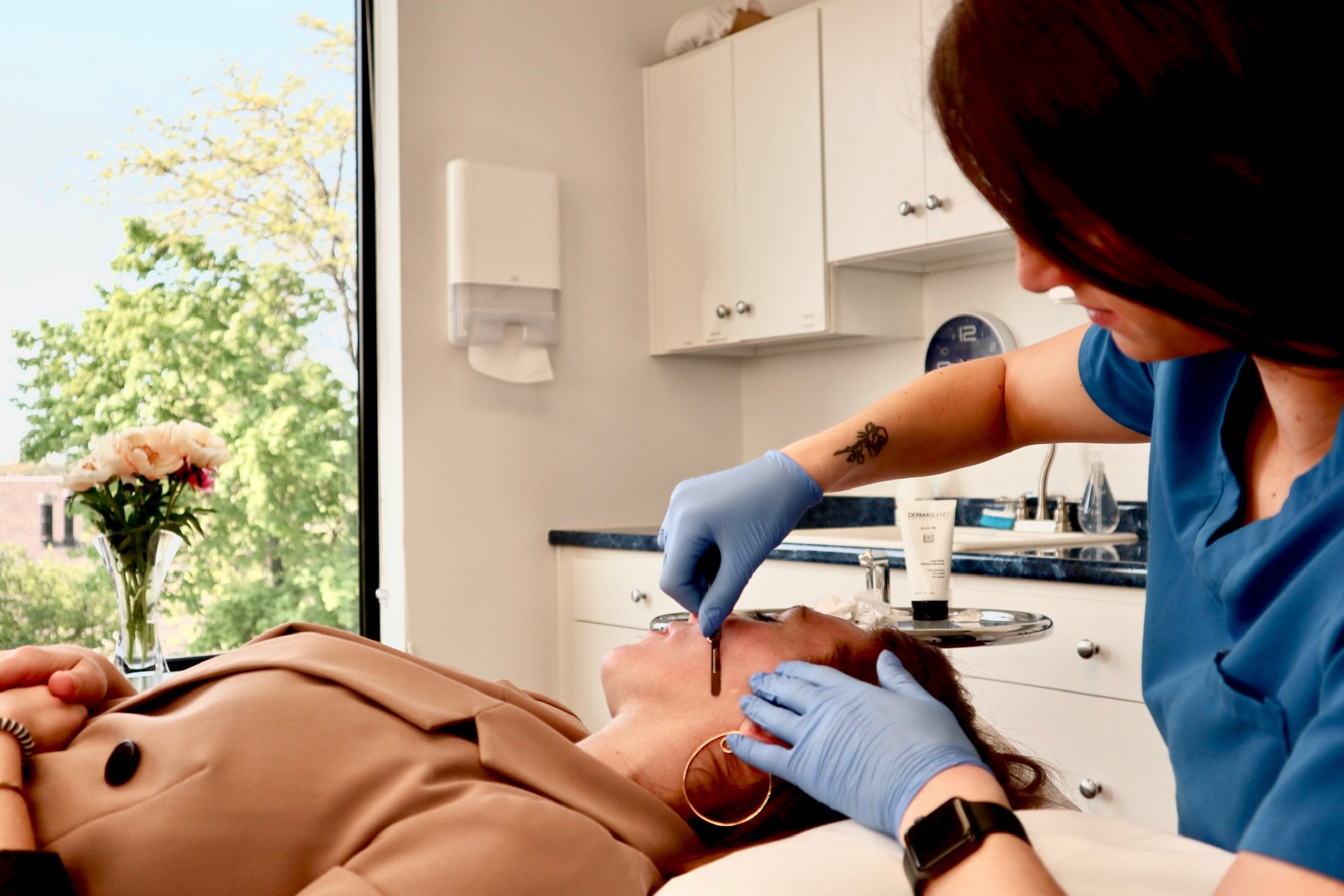 Woman micro blading doctor's office