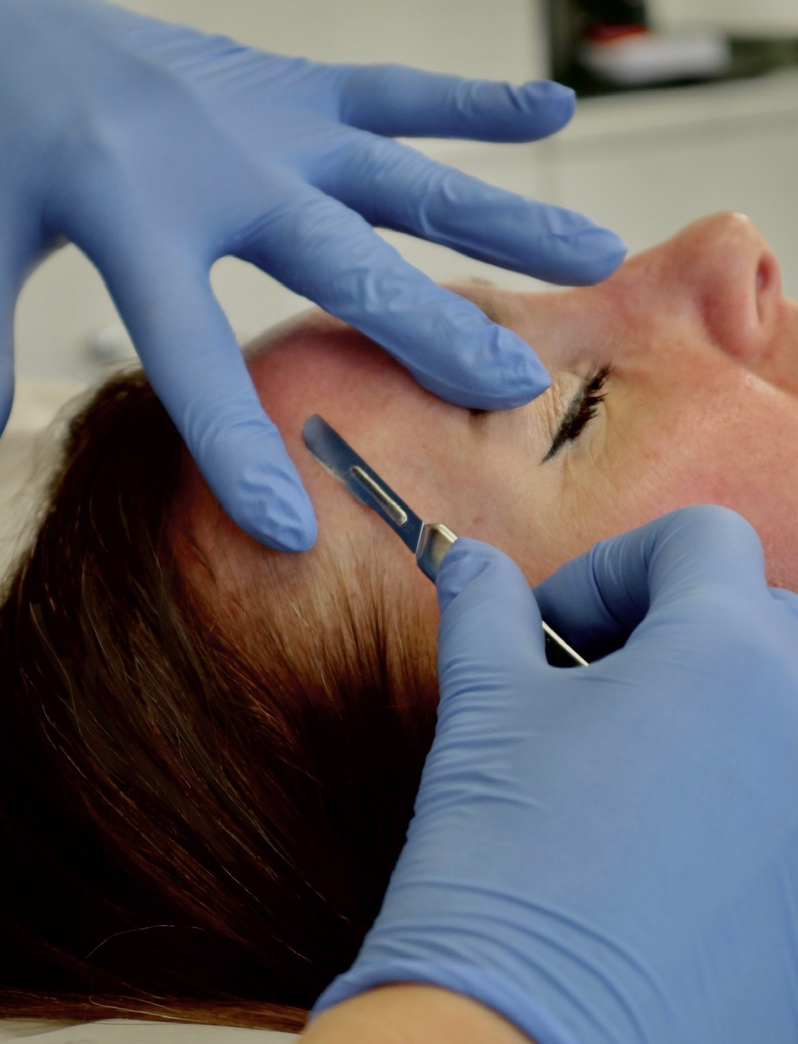 Woman micro blading doctor's office