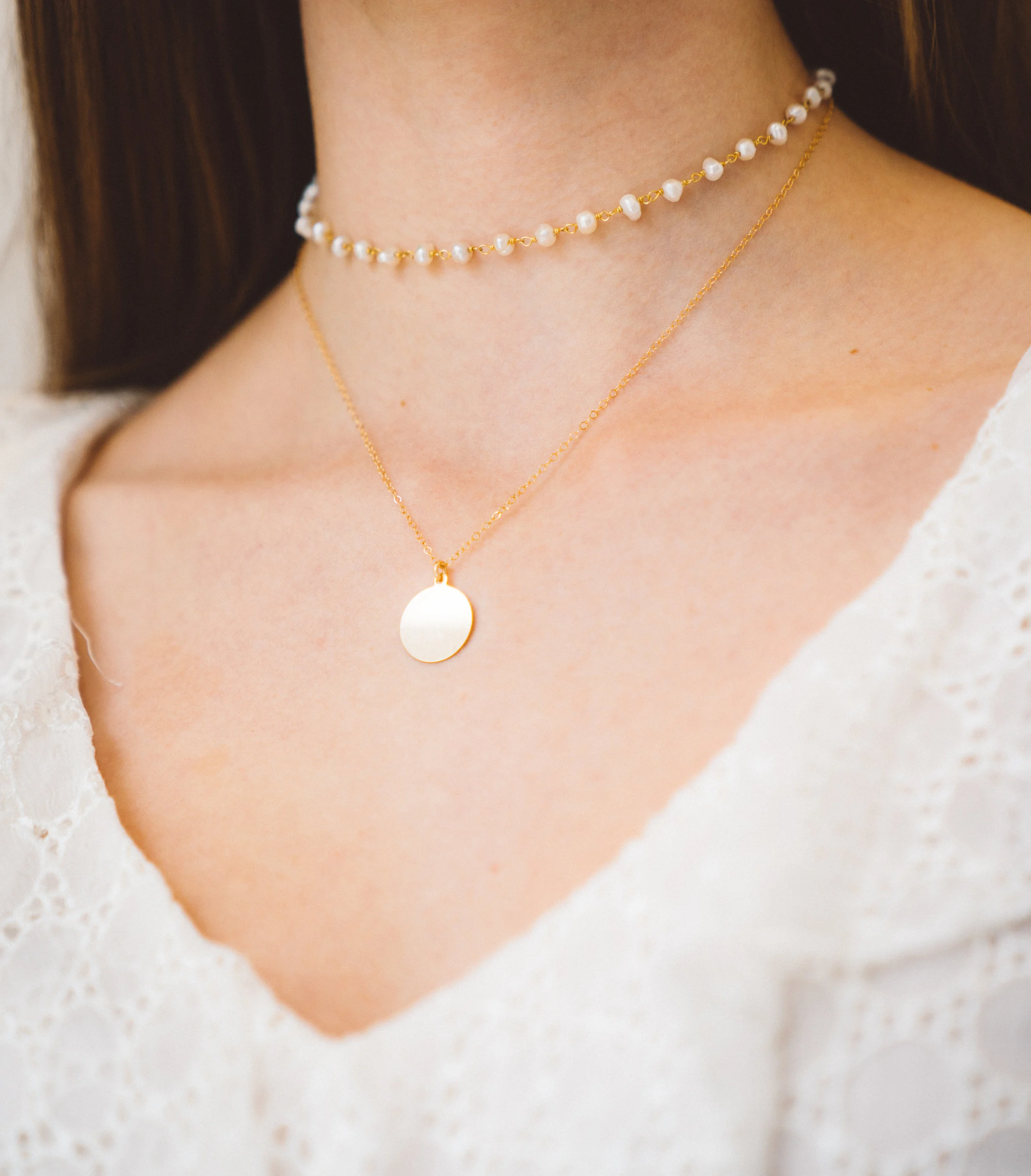 Connect with the heart chakra with our golden disc pendant