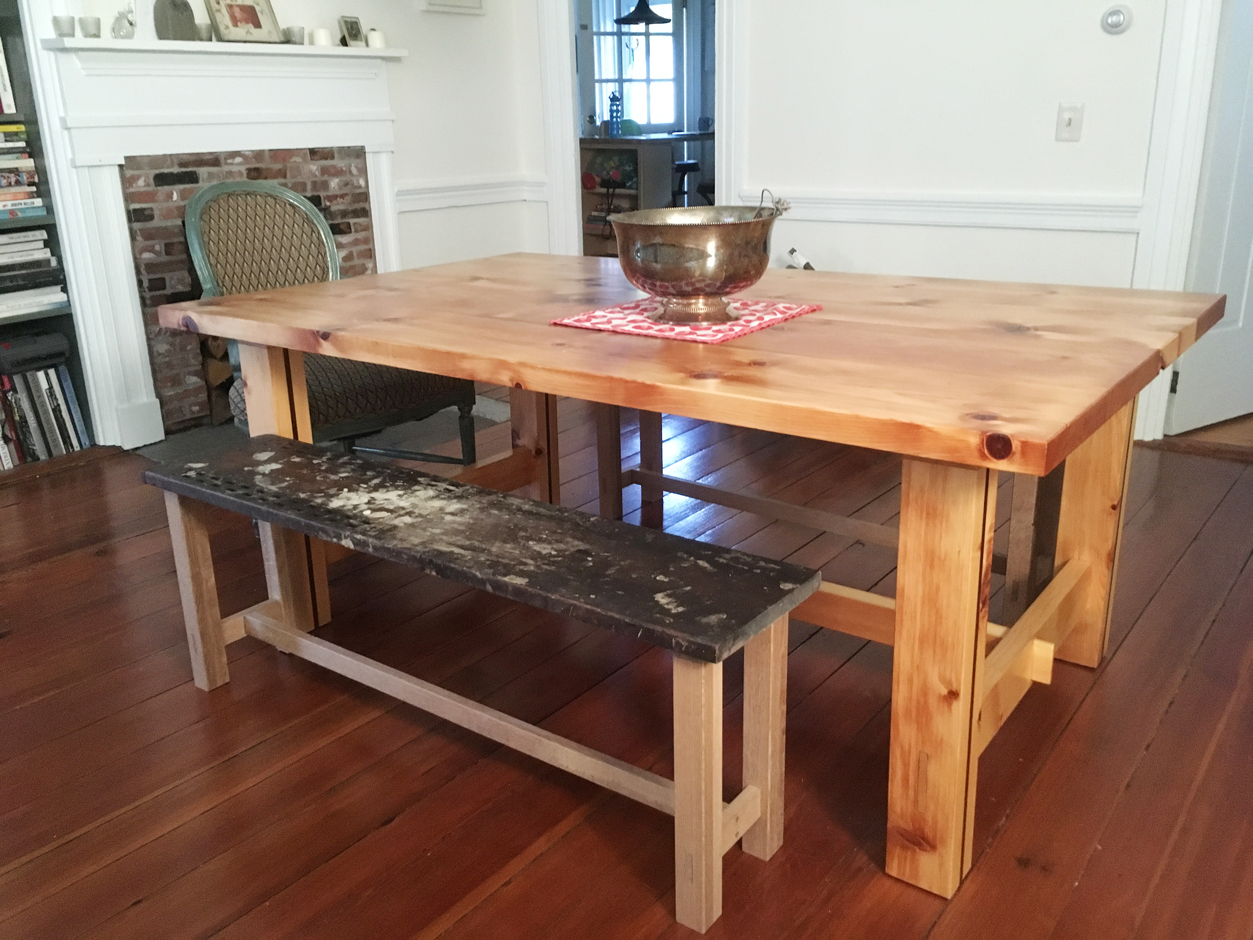 Chunky Farm house table made out oak. Benches made out of reclaimed found wood.
