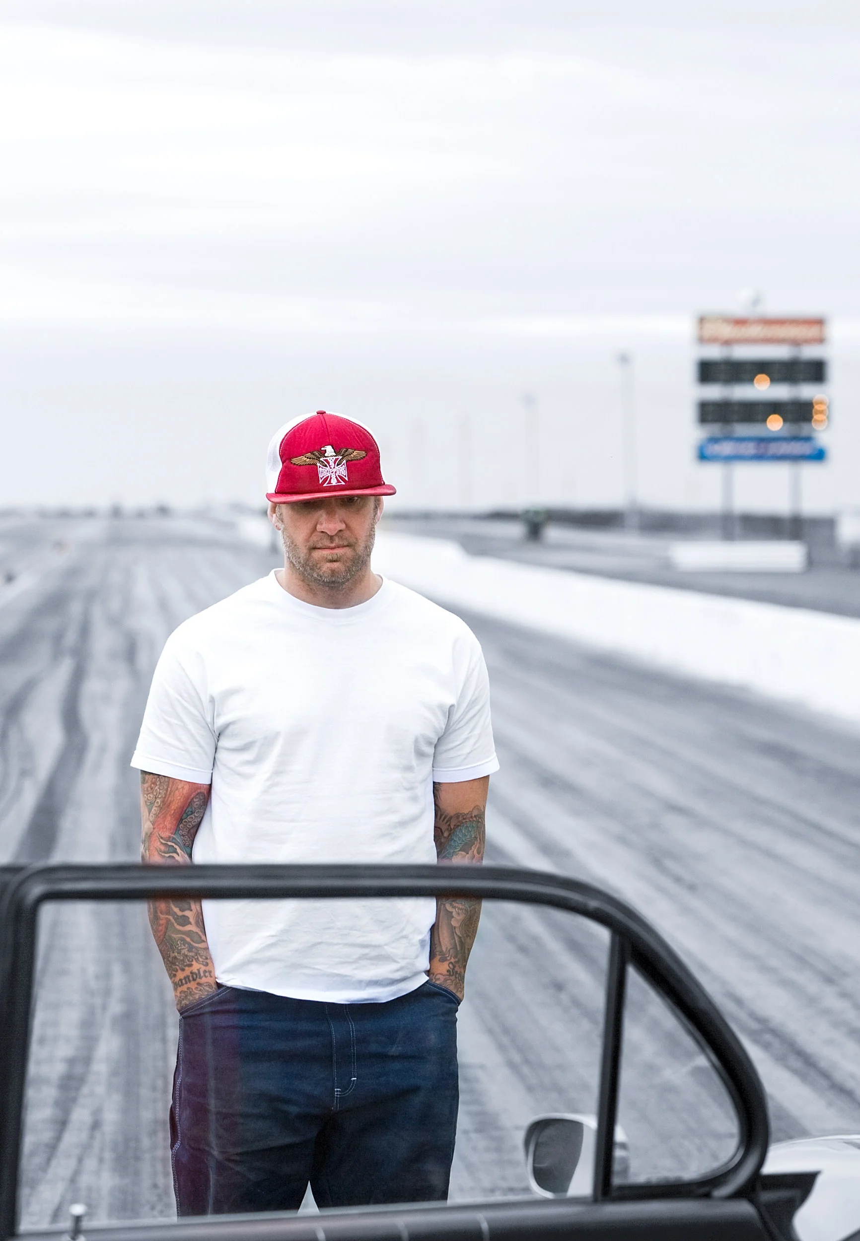 Jesse James, host of Monster Garage standing on drag strip