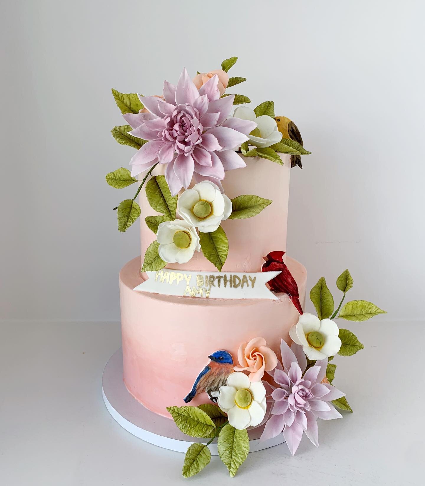 The direction was a beautiful luscious cake with bright summer flowers and love song birds and the rest was up to us to design! 🌸 Our client Amy showed the cake sketch as inspiration for her florals versus the other way around which was so flatterin